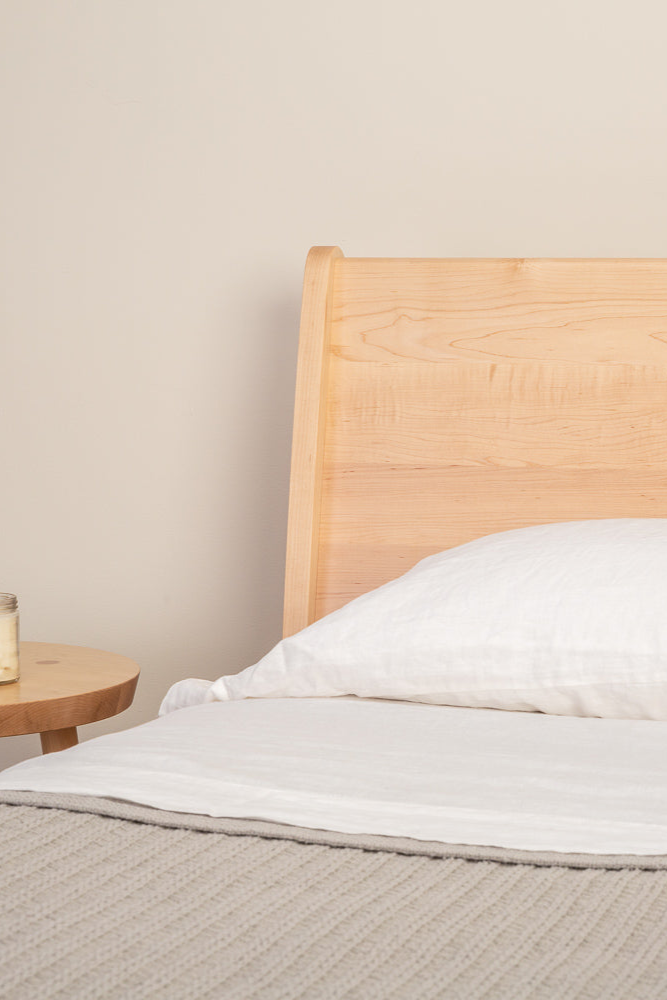 Minimalist bedroom with Mysa Nightstand and Bed in solid maple wood