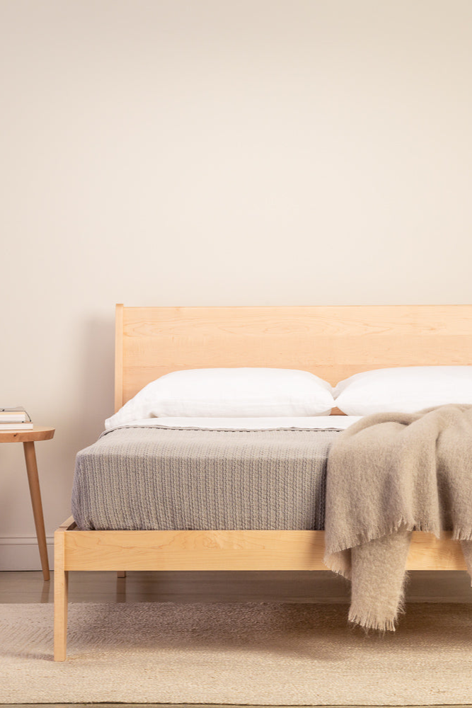 Minimalist bedroom with Mysa Nightstand and Bed in solid maple wood