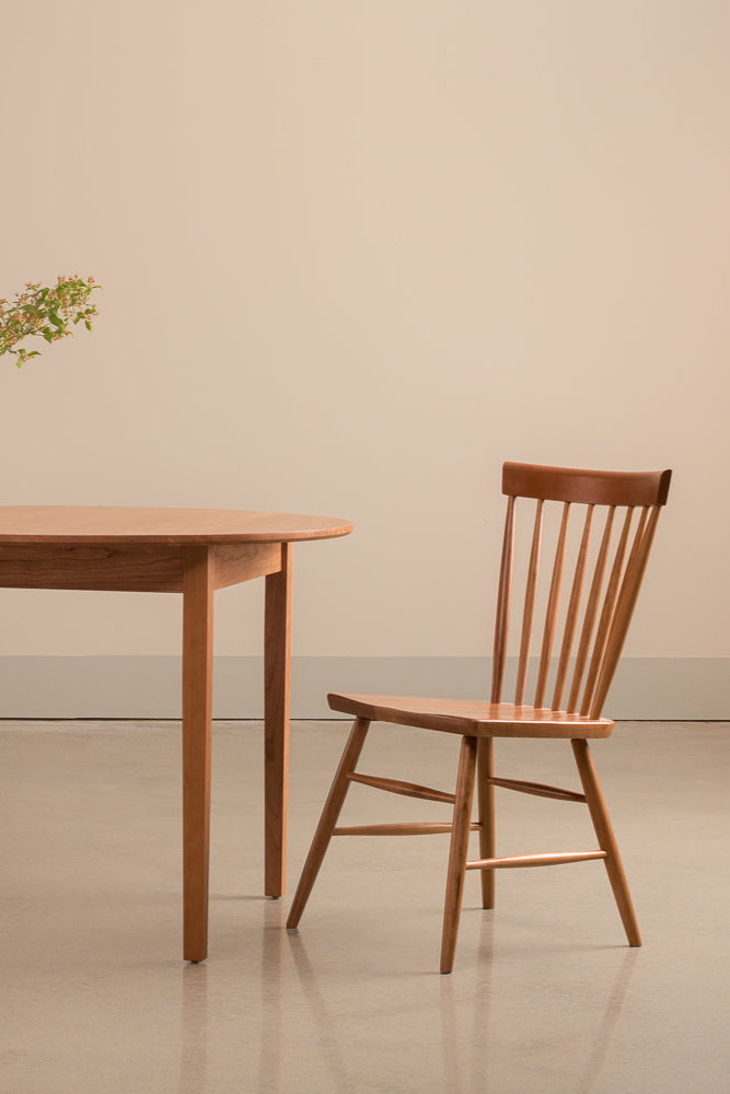 Harvest chairs and Shaker Round Dining Table in cherry with large leafy centerpiece