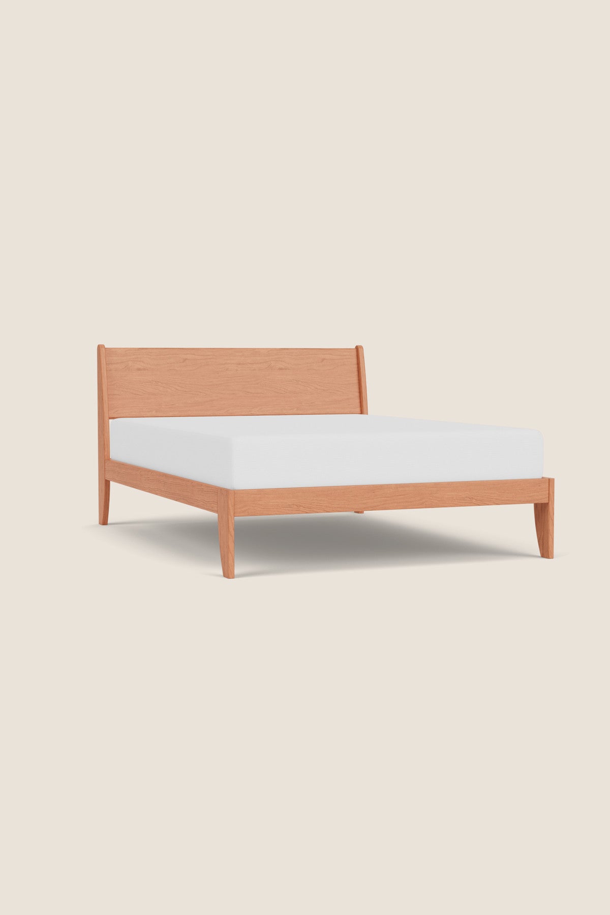 Modern sleigh bed in cherry with low profile, from Maine's Chilton Furniture Co.