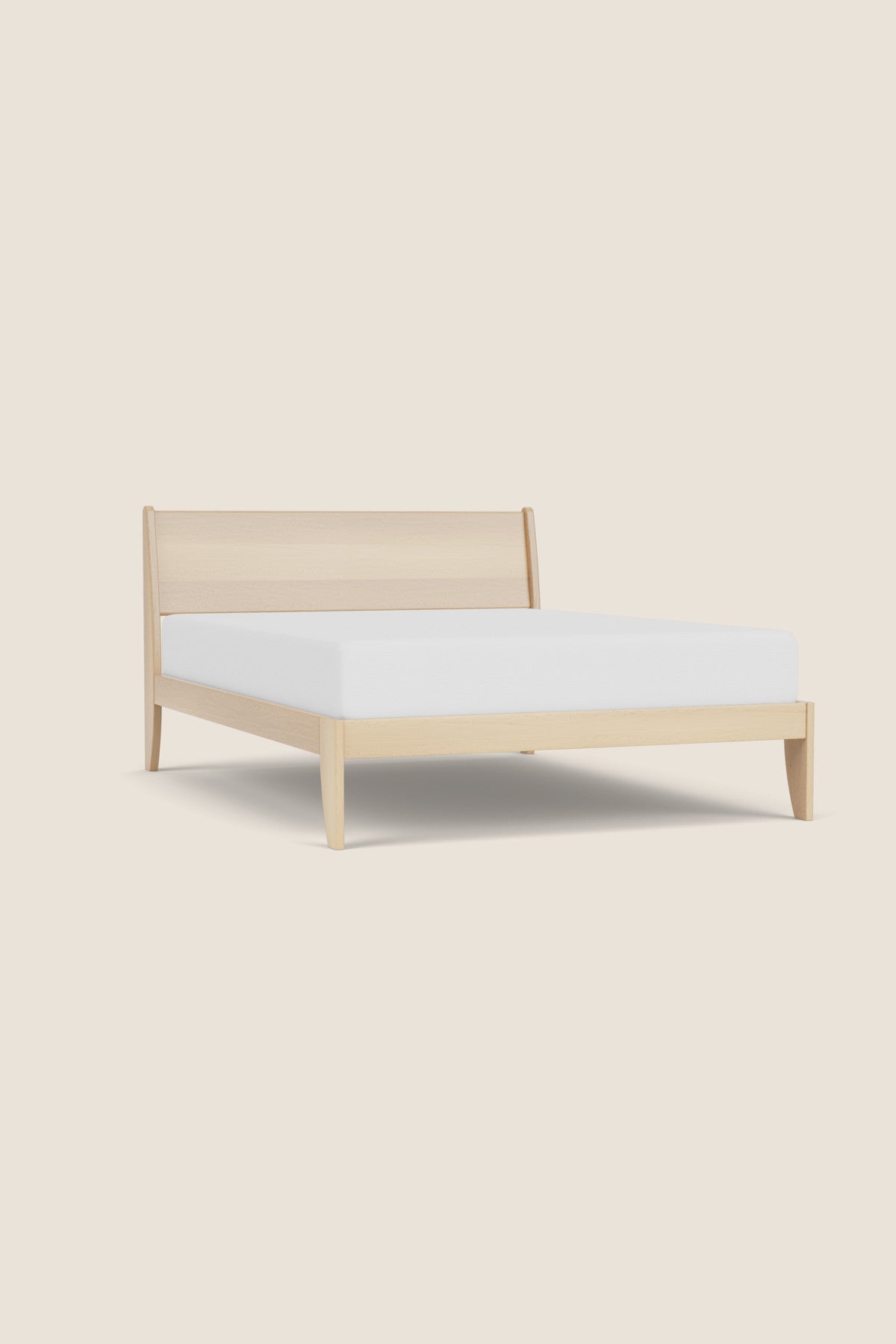 Modern sleigh bed in maple with low profile, from Maine's Chilton Furniture Co.