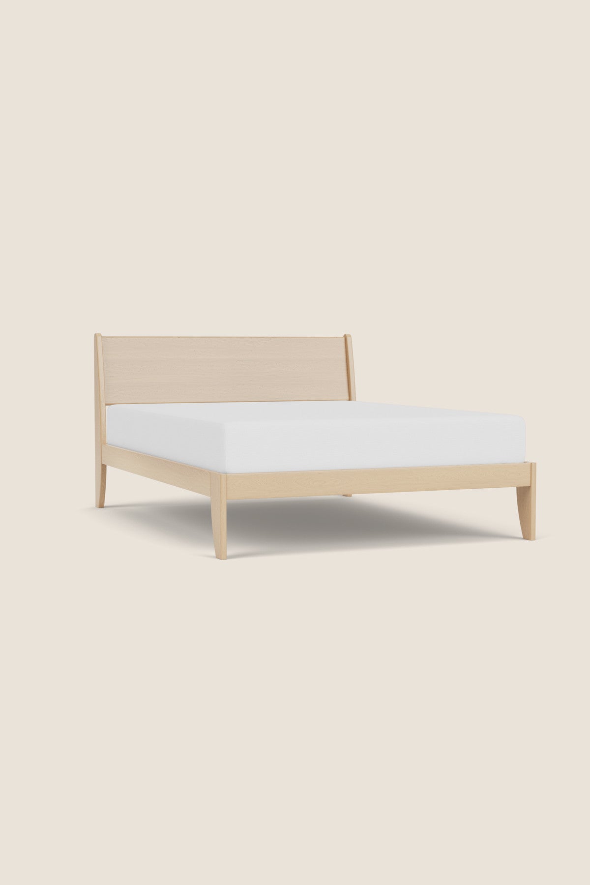 Modern sleigh bed in maple with low profile, from Maine's Chilton Furniture Co.