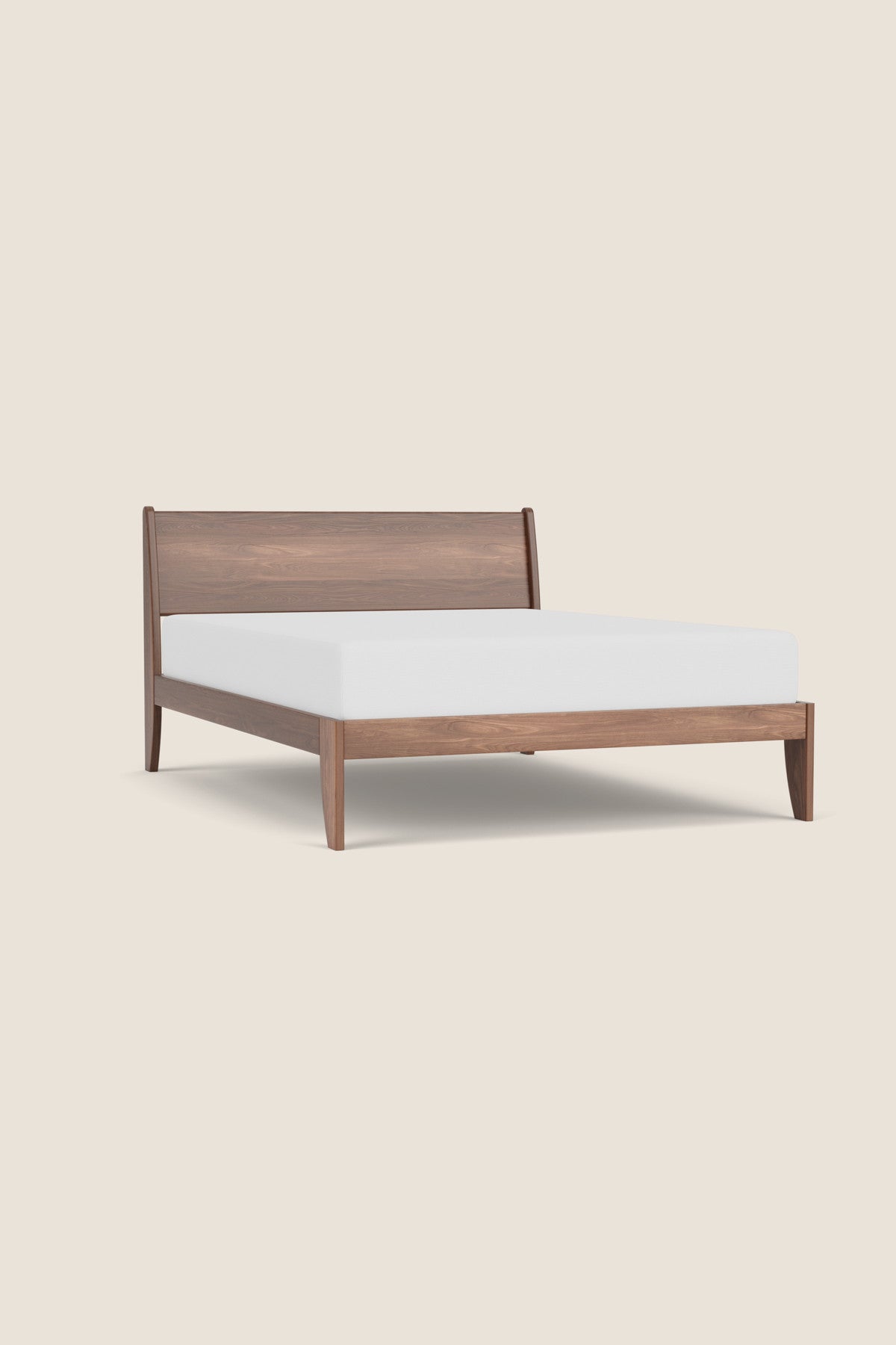 Modern sleigh bed in walnut with low profile, from Maine's Chilton Furniture Co.