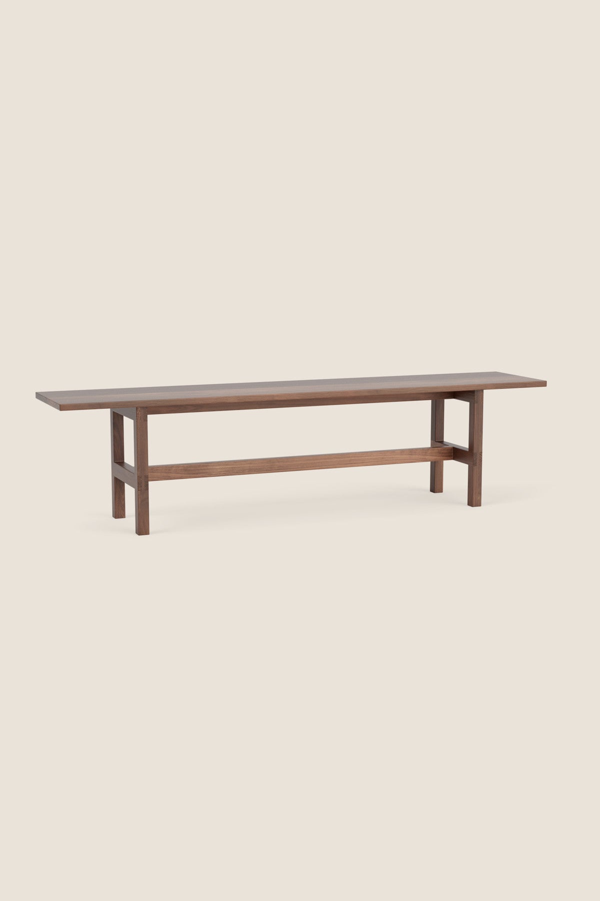 Modern trestle bench with visible joinery in walnut wood, from Maine's Chilton Furniture