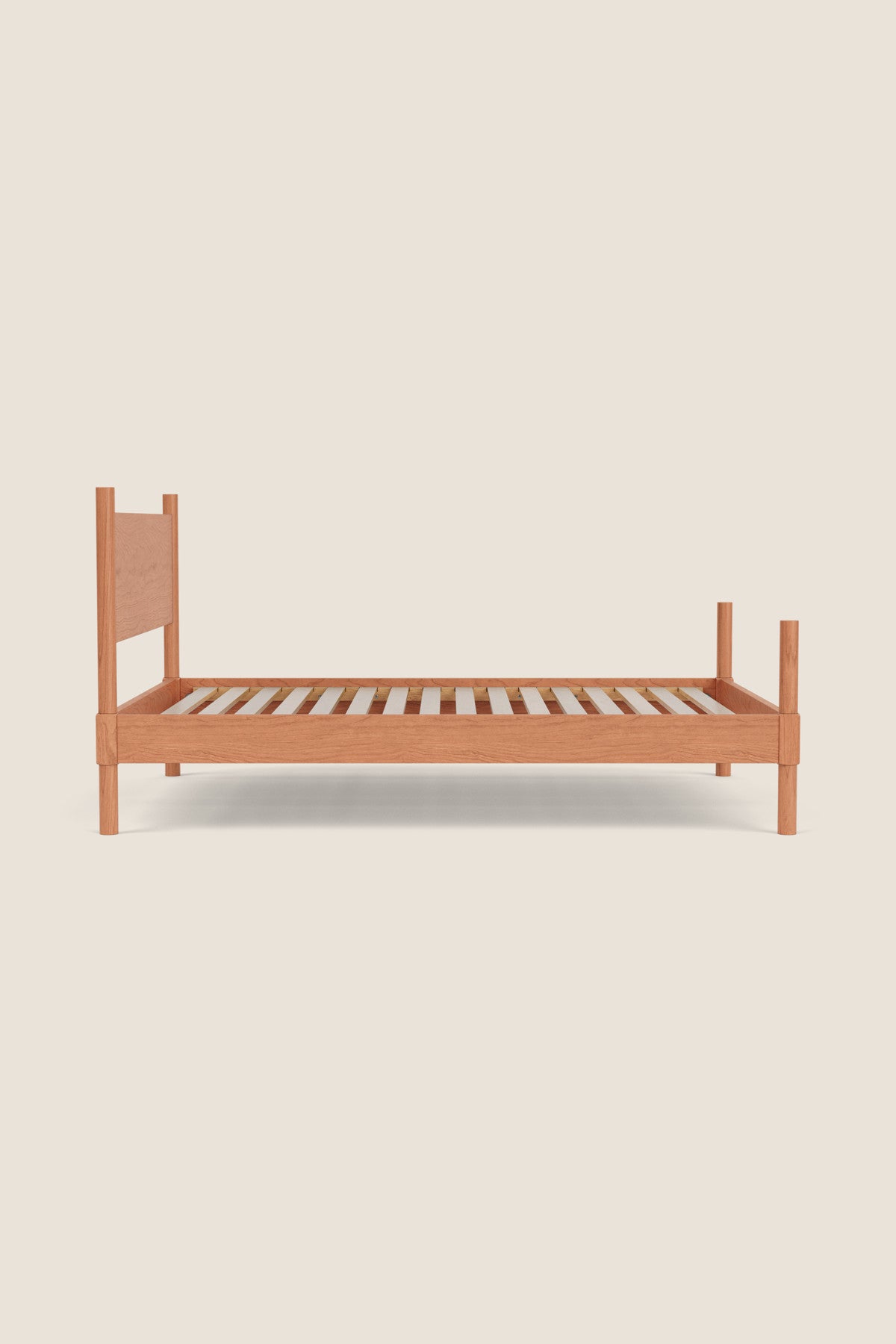 Wooden bed frame on a beige background