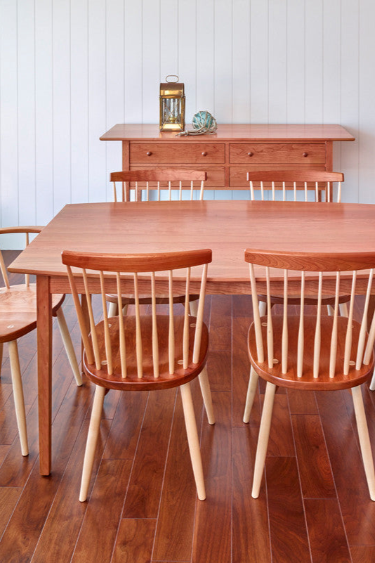 Clean dining room with Shaker sideboard, Bass Harbor Table and six Windsor style chairs, all made of cherry wood