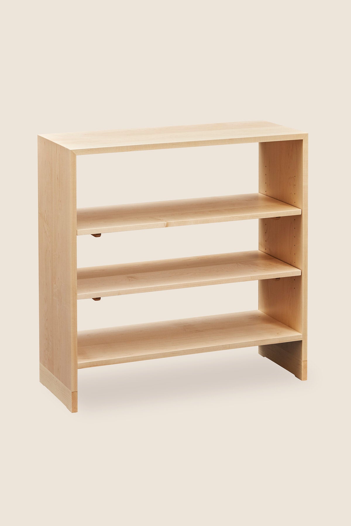 Backless Lubec Short Shelf in maple with breadboard leg base