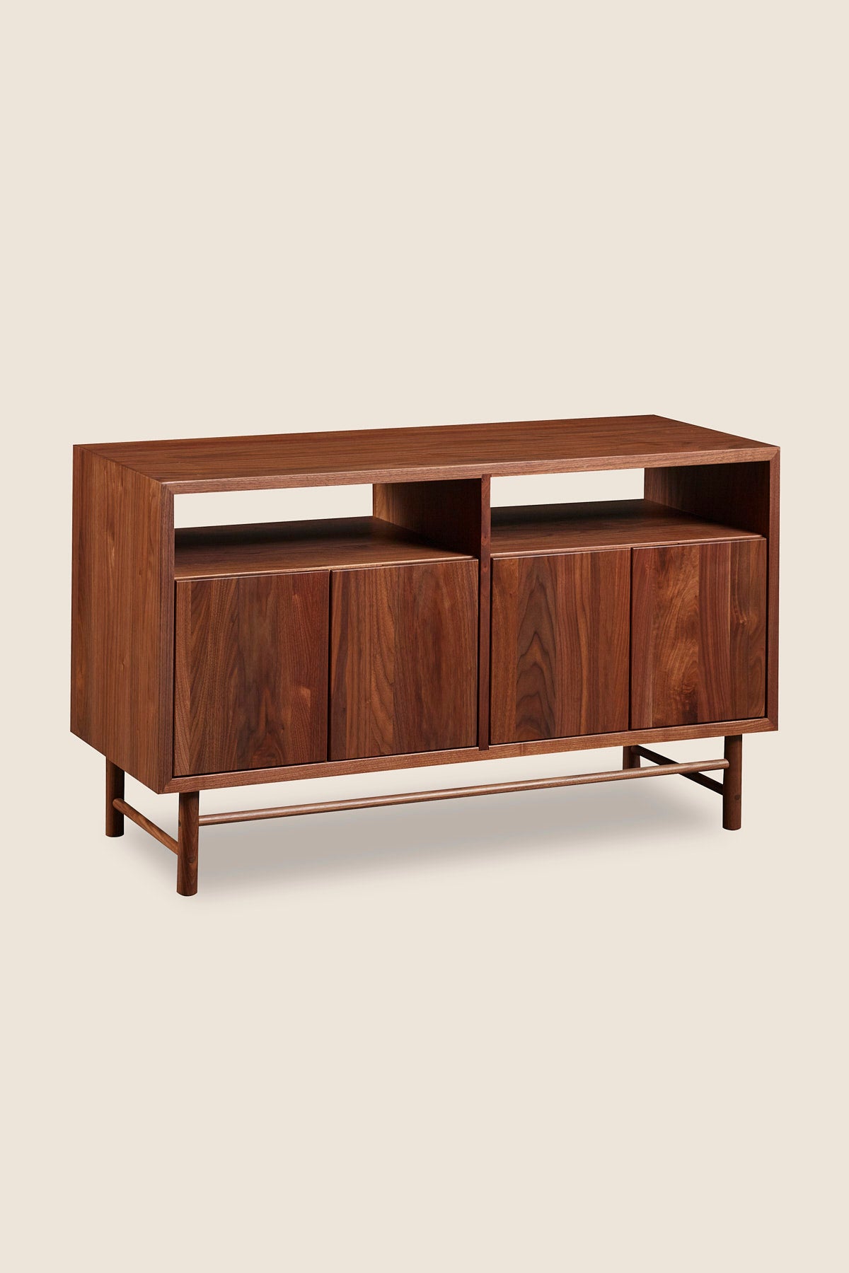 Mid-century modern Navarend media case in solid walnut wood with round legs and stretchers and four doors with storage space