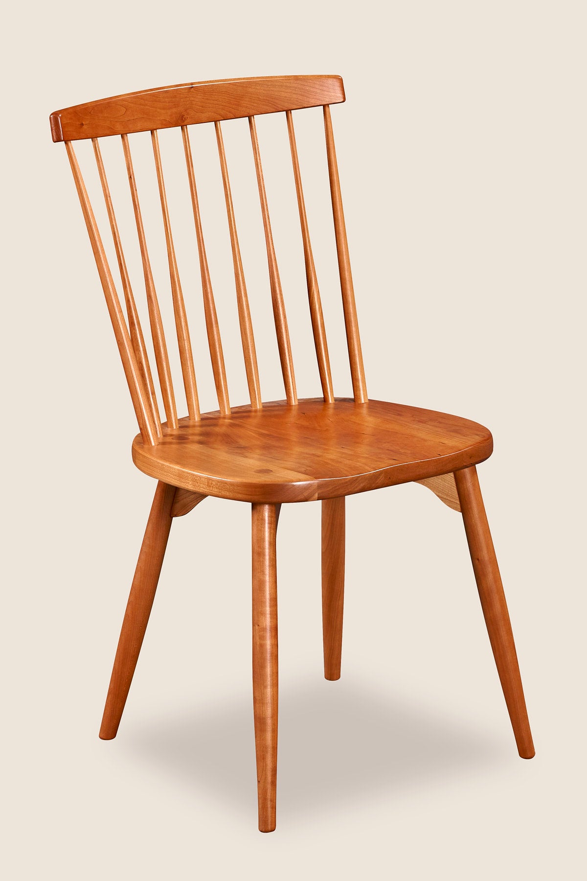 Classic spindle back chair with round tapered legs in solid cherry wood