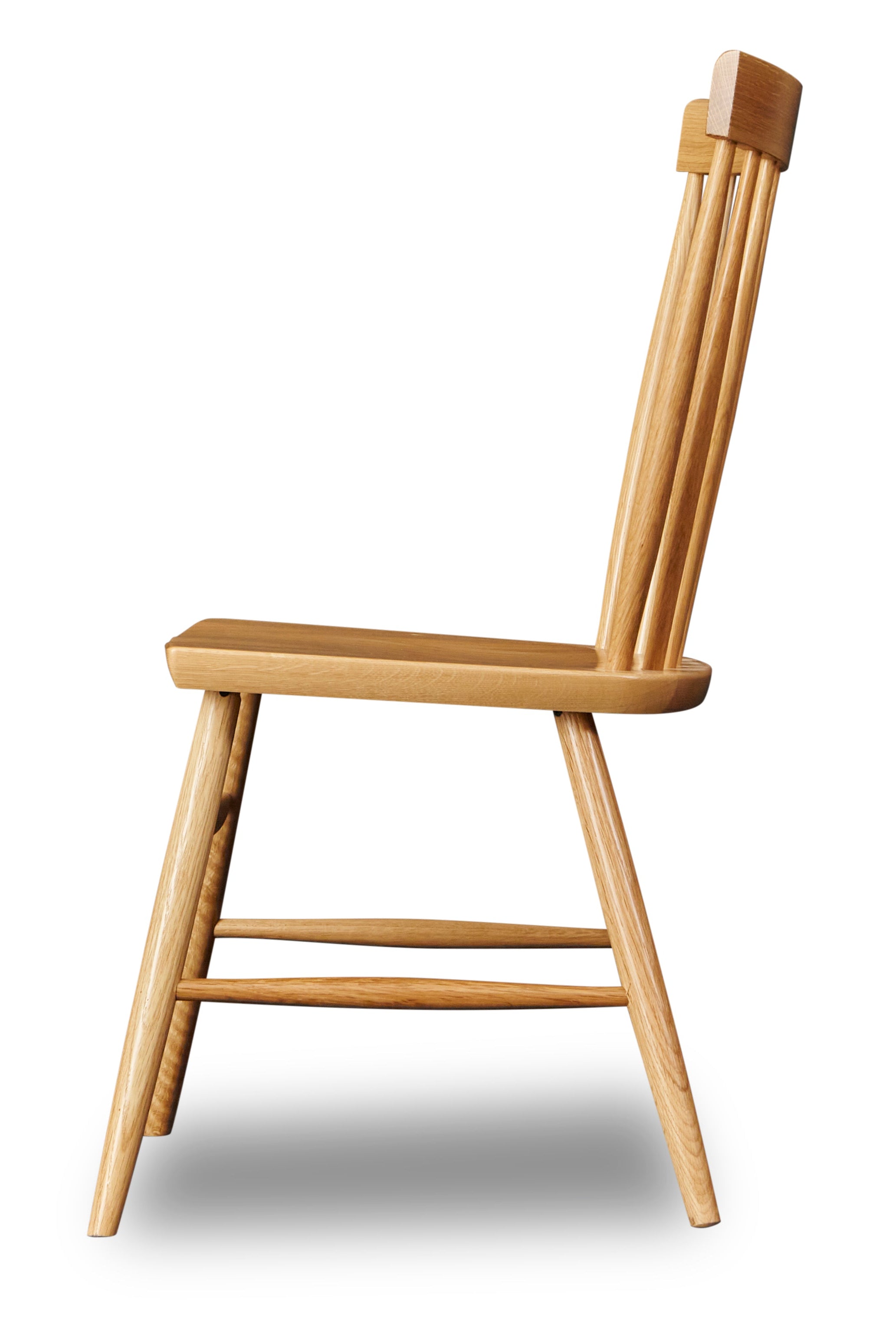 Side view of spindle style dining chair in white oak wood from Chilton Furniture