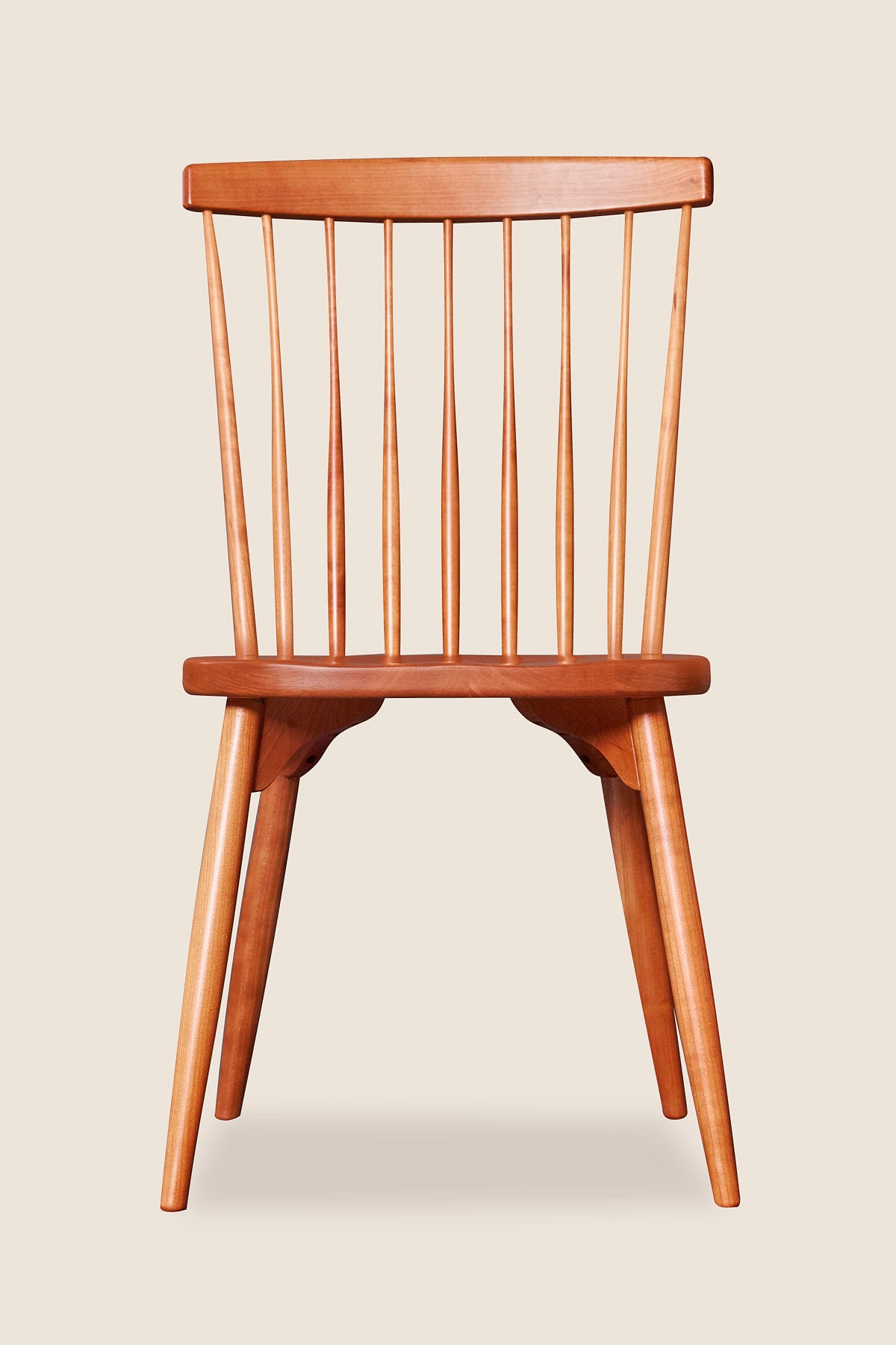Classic Chilton spindle chair with round tapered legs in solid cherry wood
