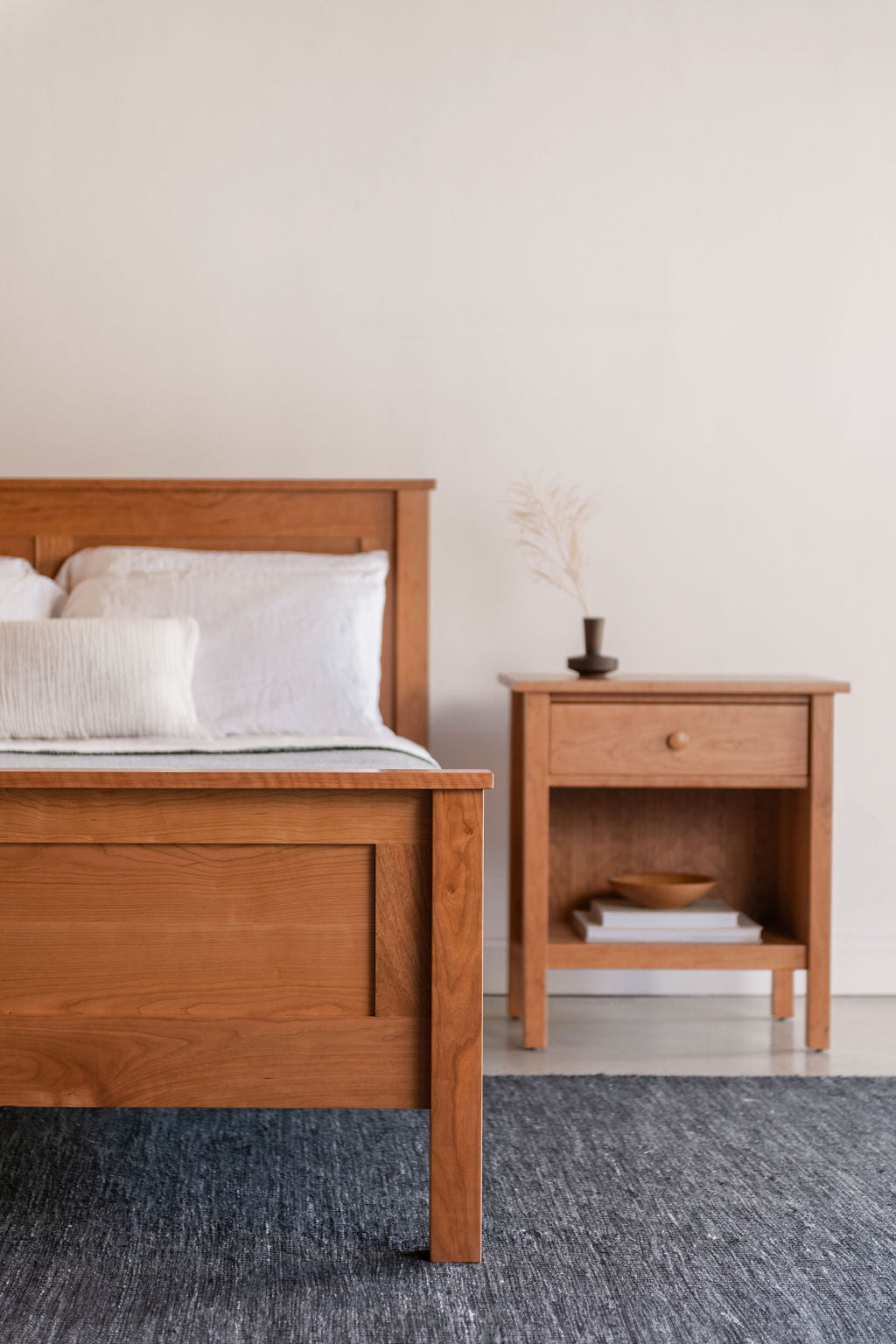 Bethel Shaker Bedroom set in cherry wood with modern styling and blue rug
