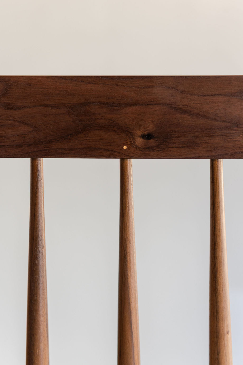 Detailed view of the spindles and pins on the traditional Shaker style spindle Broadside Bench