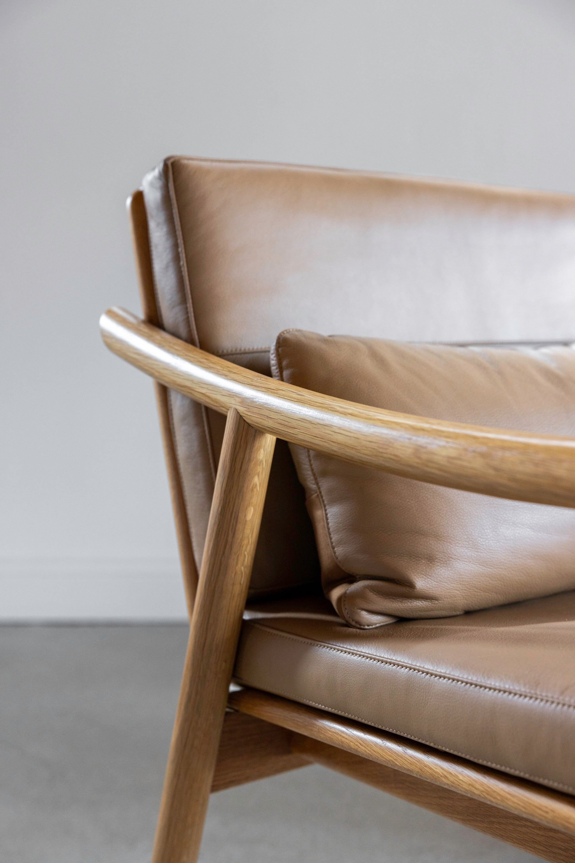 Arm joint details on solid wood Nautilus lounge chair from Maine's Chilton Furniture Co.