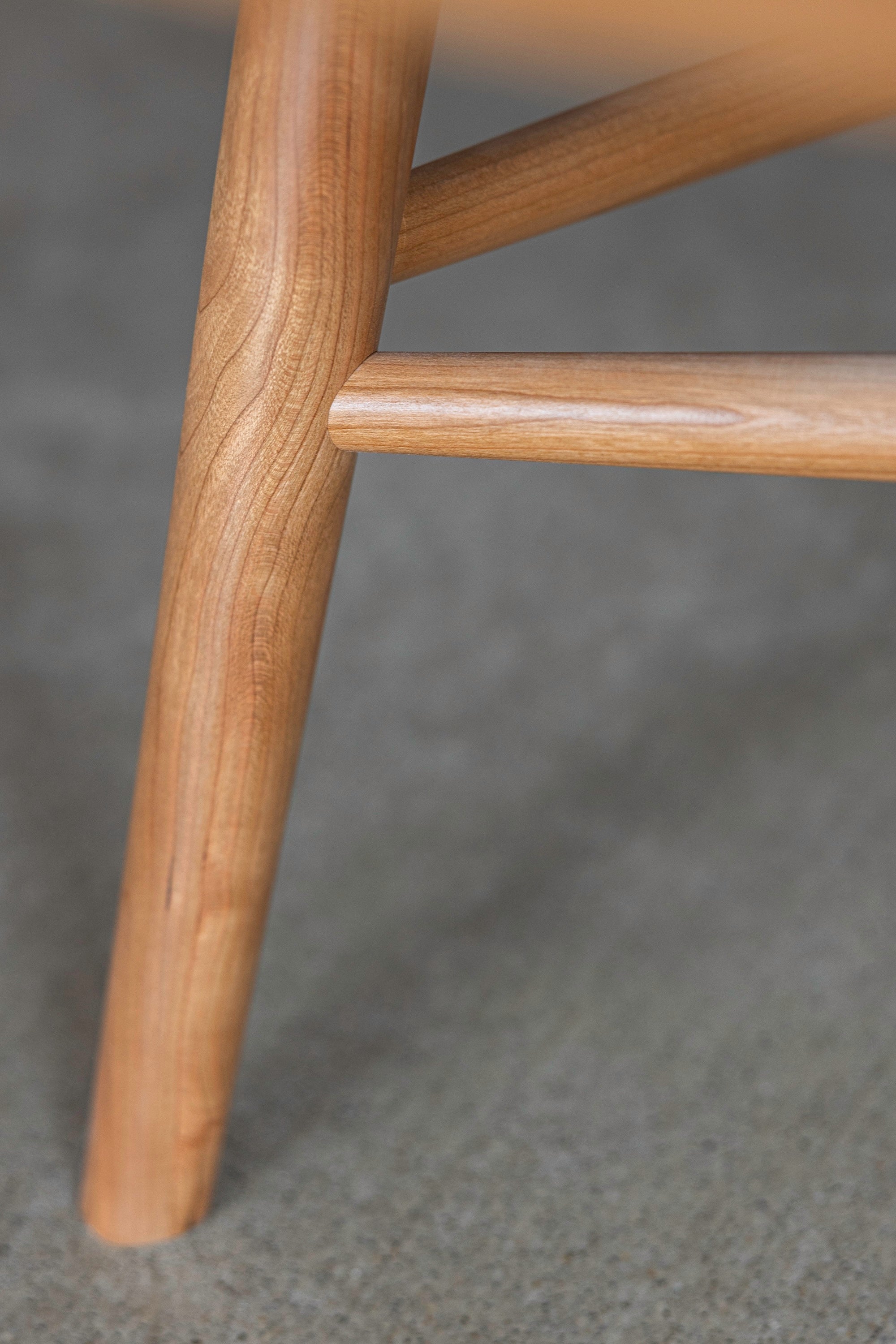 Joinery of solid cherry wood legs and stretchers on furniture from Chilton in Maine