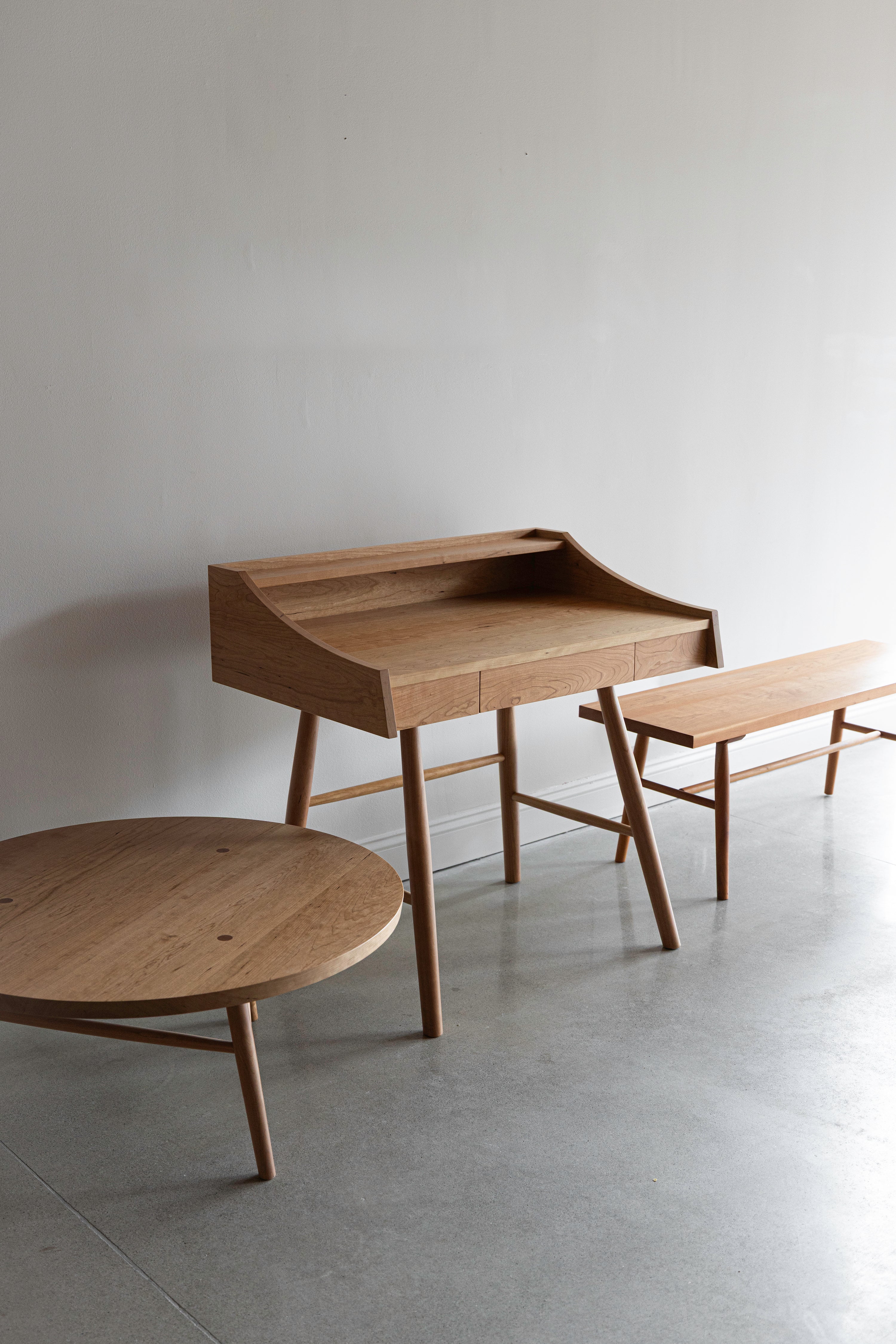 hudson collection showing coffee table, desk, and bench