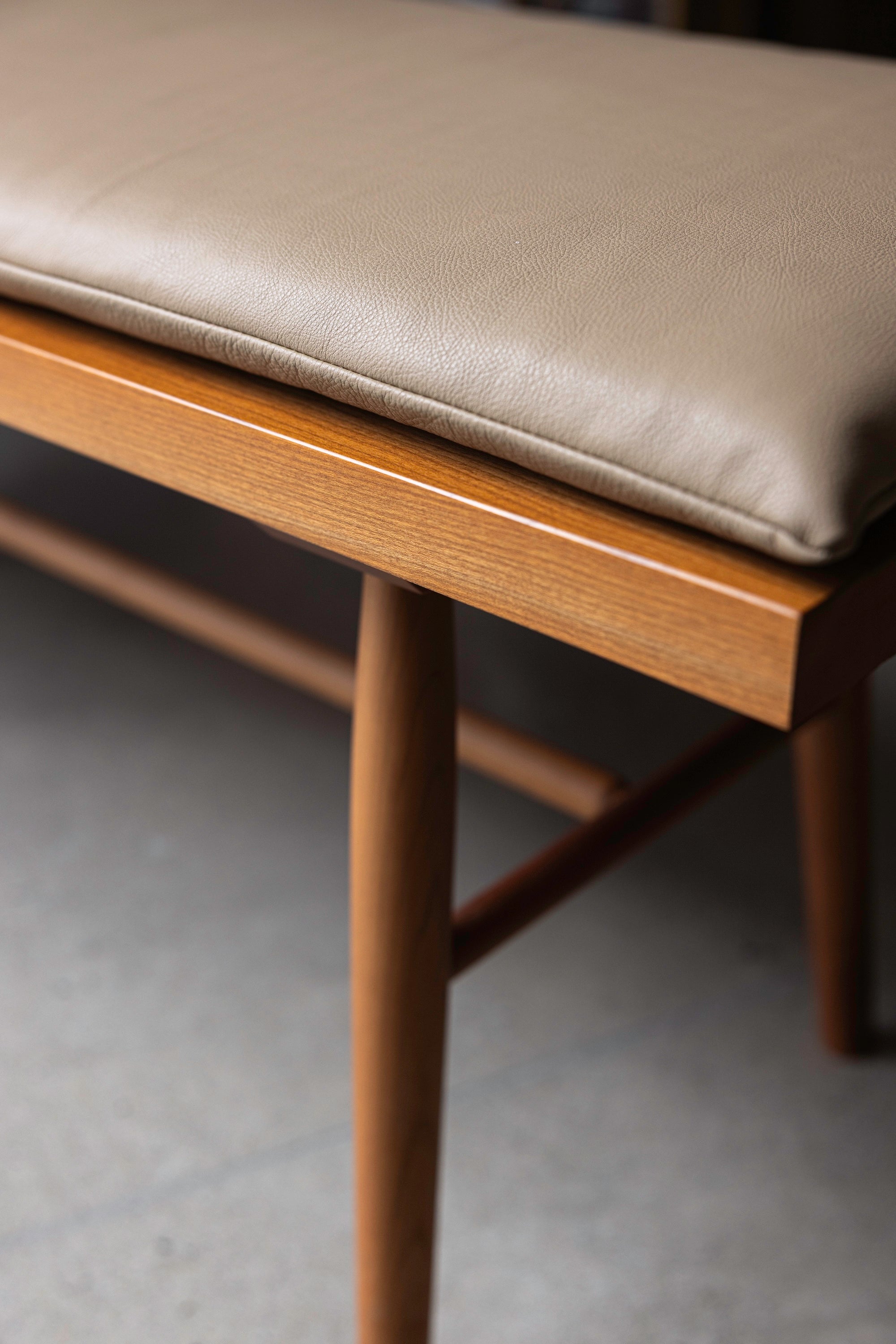 Details of the cherry grain and leather cushion on the Hudson Bench from Chilton Furniture