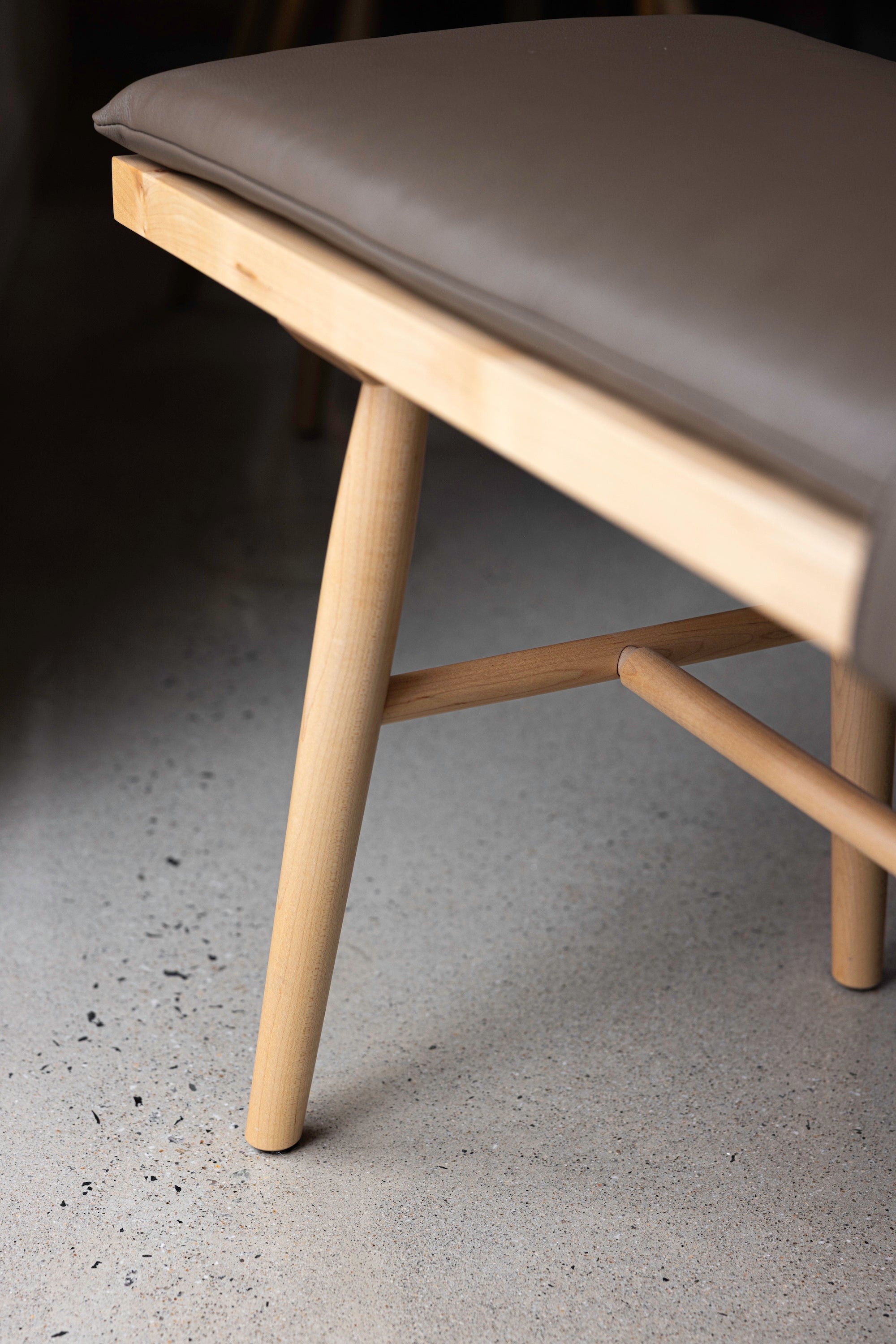 Leg, joinery and upholstered cushion details of the maple wood Hudson Bench from Chilton Furniture
