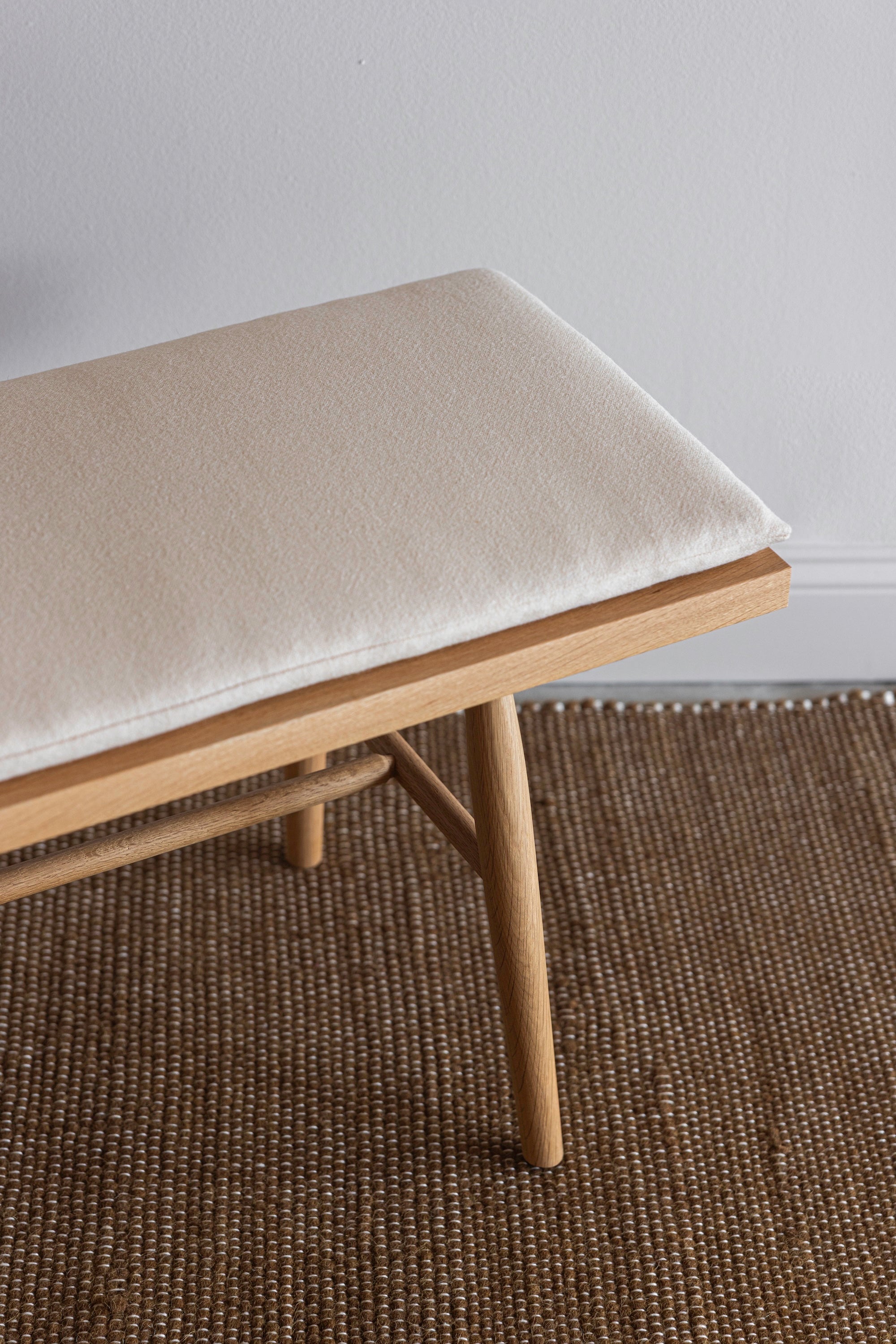 Details of the Hudson Bench upholstered cushion, turned legs and joinery