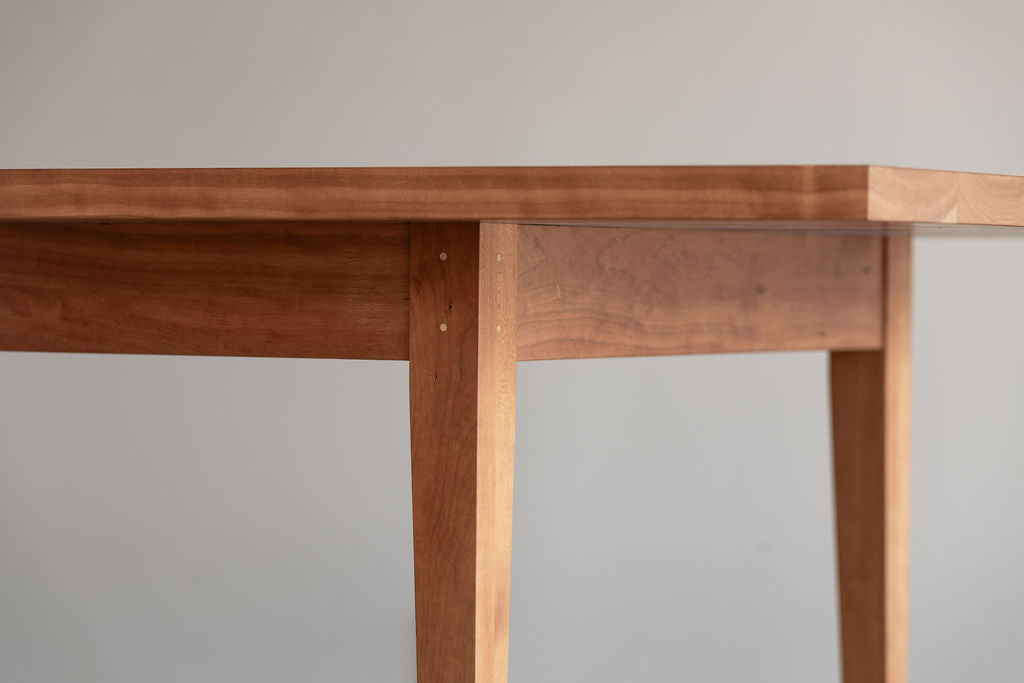 Details of the maple pins as part of the traditional joinery used on the solid wood Shaker Heirloom Dining Table