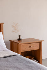 Bethel Shaker Nightstand and Bed in cherry wood, styled with soft linens and modern decor