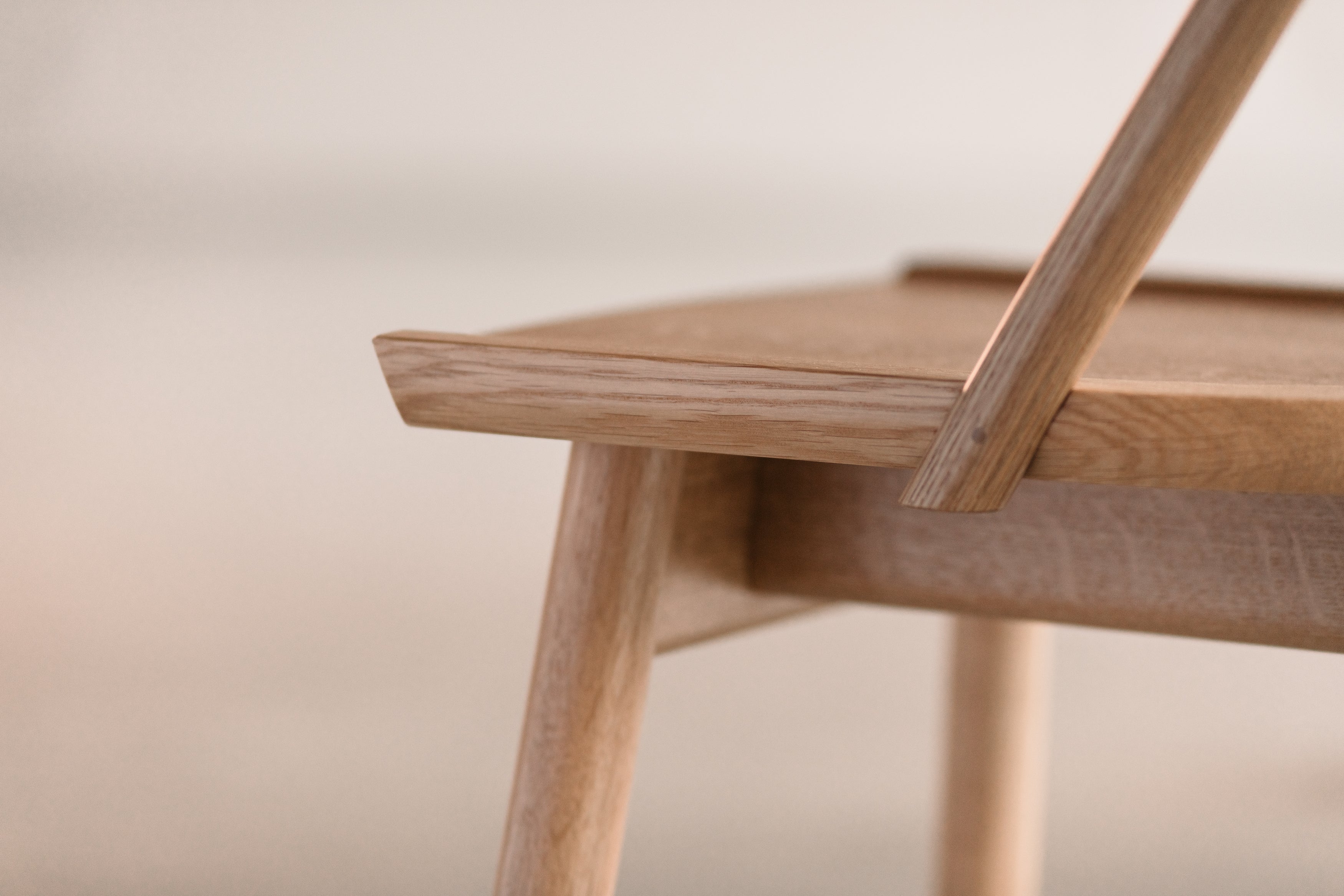 Close up details of the overlapping bow on the white oak Atlas Chair from Chilton Furniture in Maine