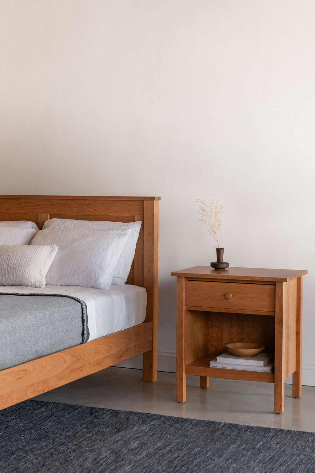 Bethel Shaker Nightstand and Bed in cherry wood, styled with soft linens and modern decor