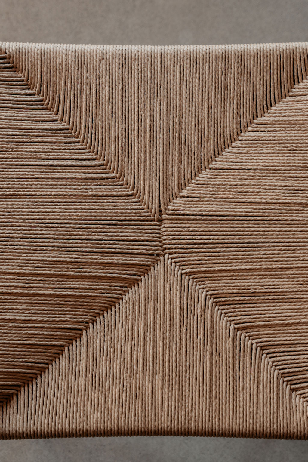 Woven danish cord seat on a dining chair.