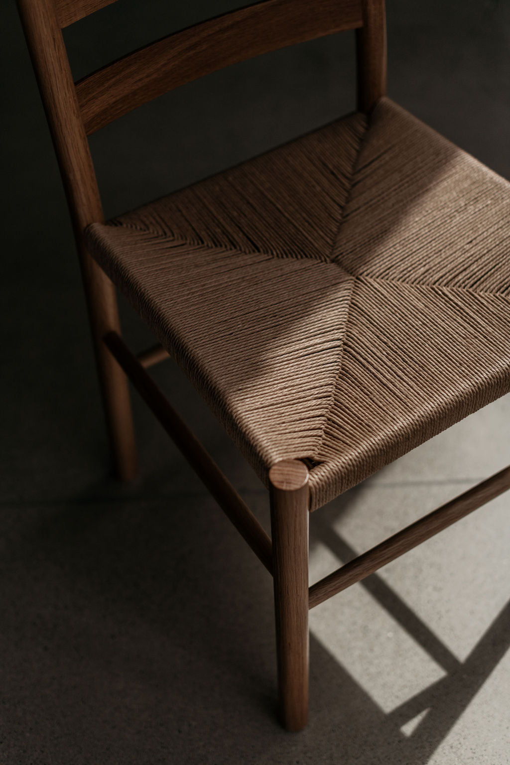 Knox ladder back chair with woven danish cord seat in walnut wood