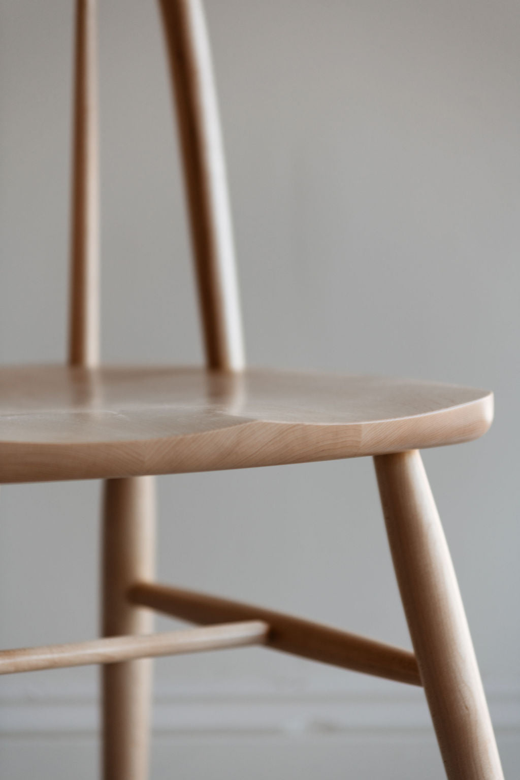Sculpted seat details on the maple wood Hudson bowback dining chair from Chilton Furniture