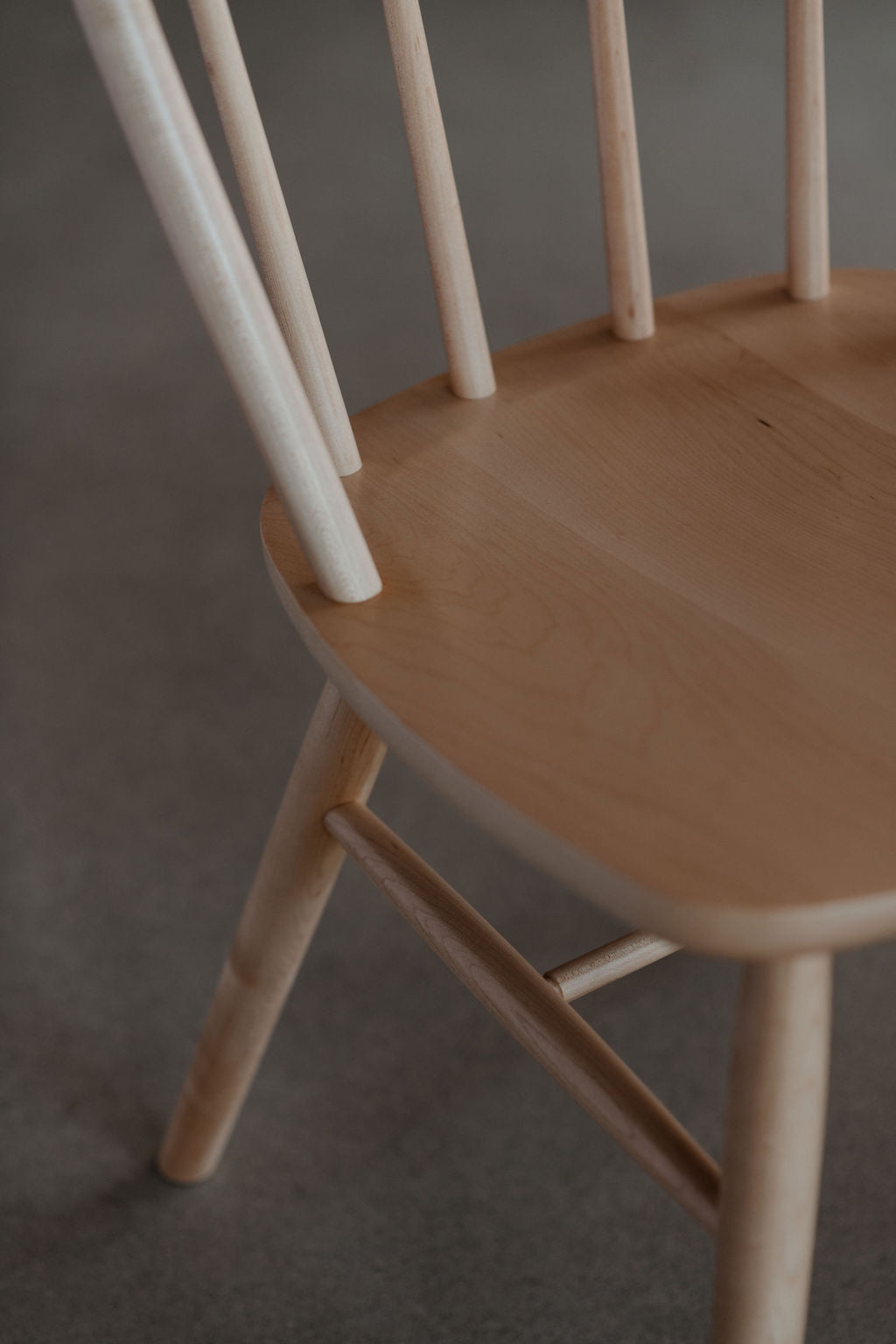 Spindle connection to seat on the maple wood Hudson bowback dining chair from Chilton Furniture