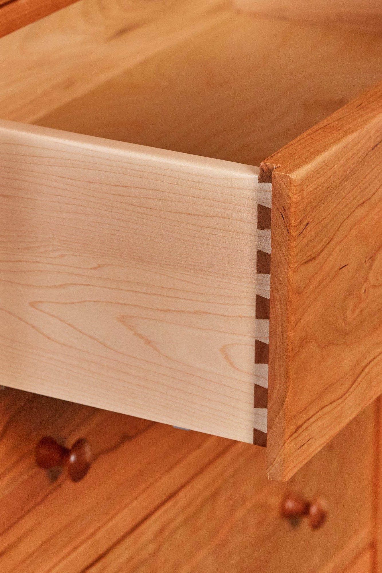 Details on open Shaker style drawer with dovetail joinery