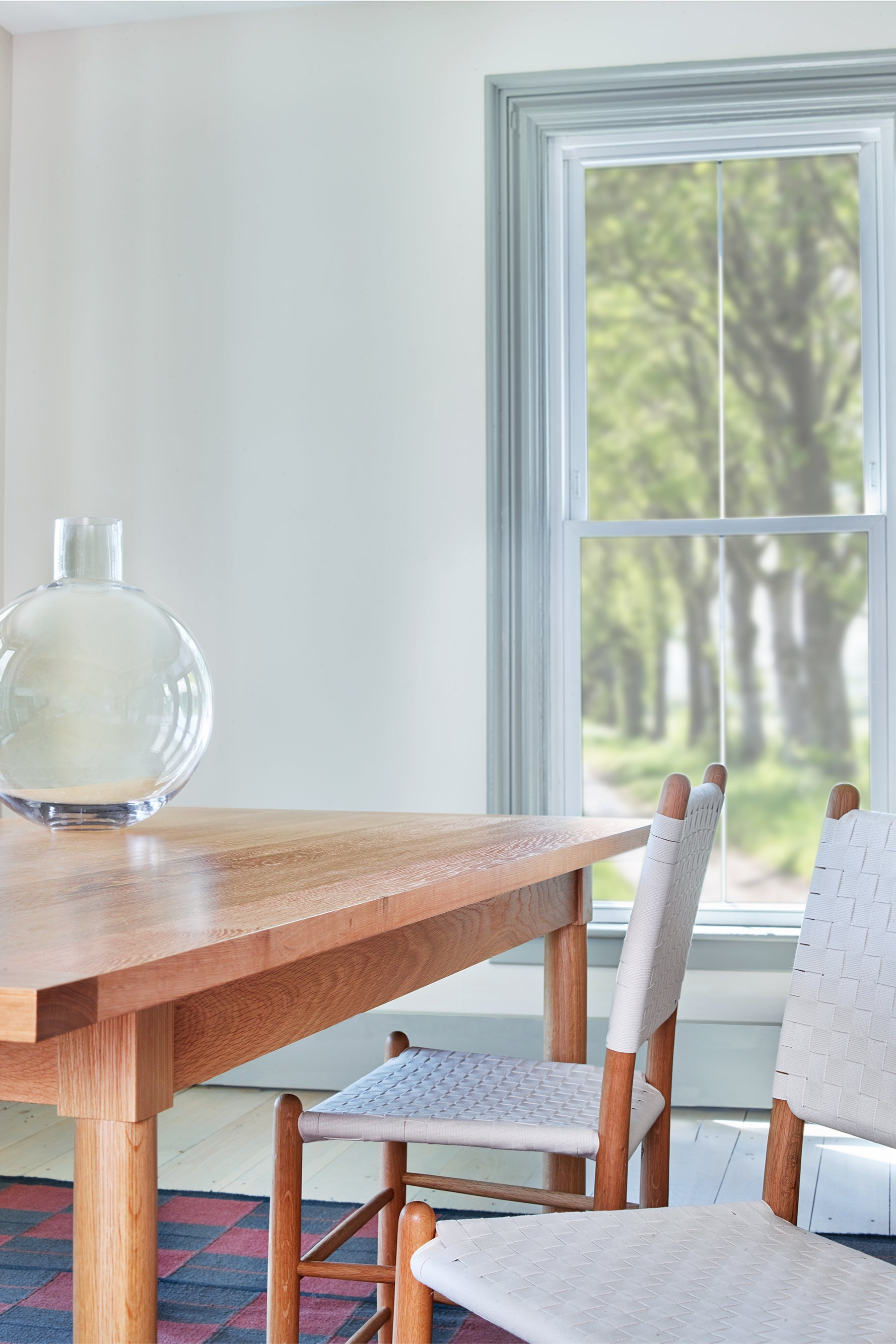 Modern dining room with white oak Revelry table and white Tappan side chairs, from Maine's Chilton Furniture Co.