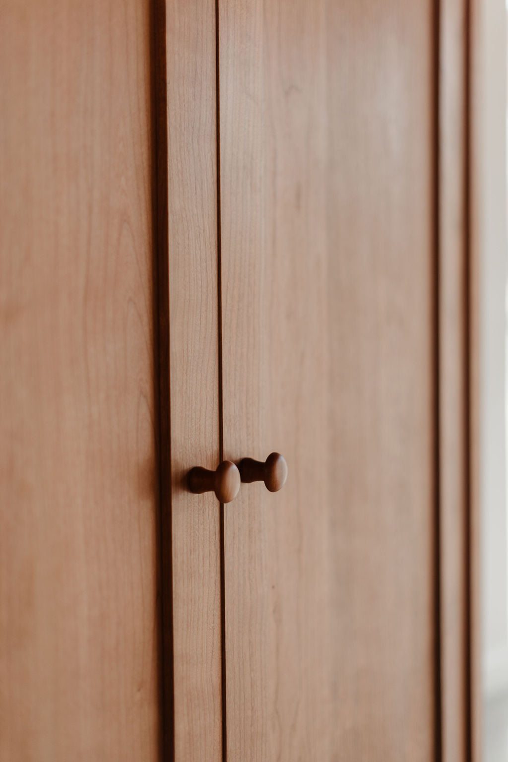 Wooden cabinet with Shaker knobs on the doors from Chilton Furniture
