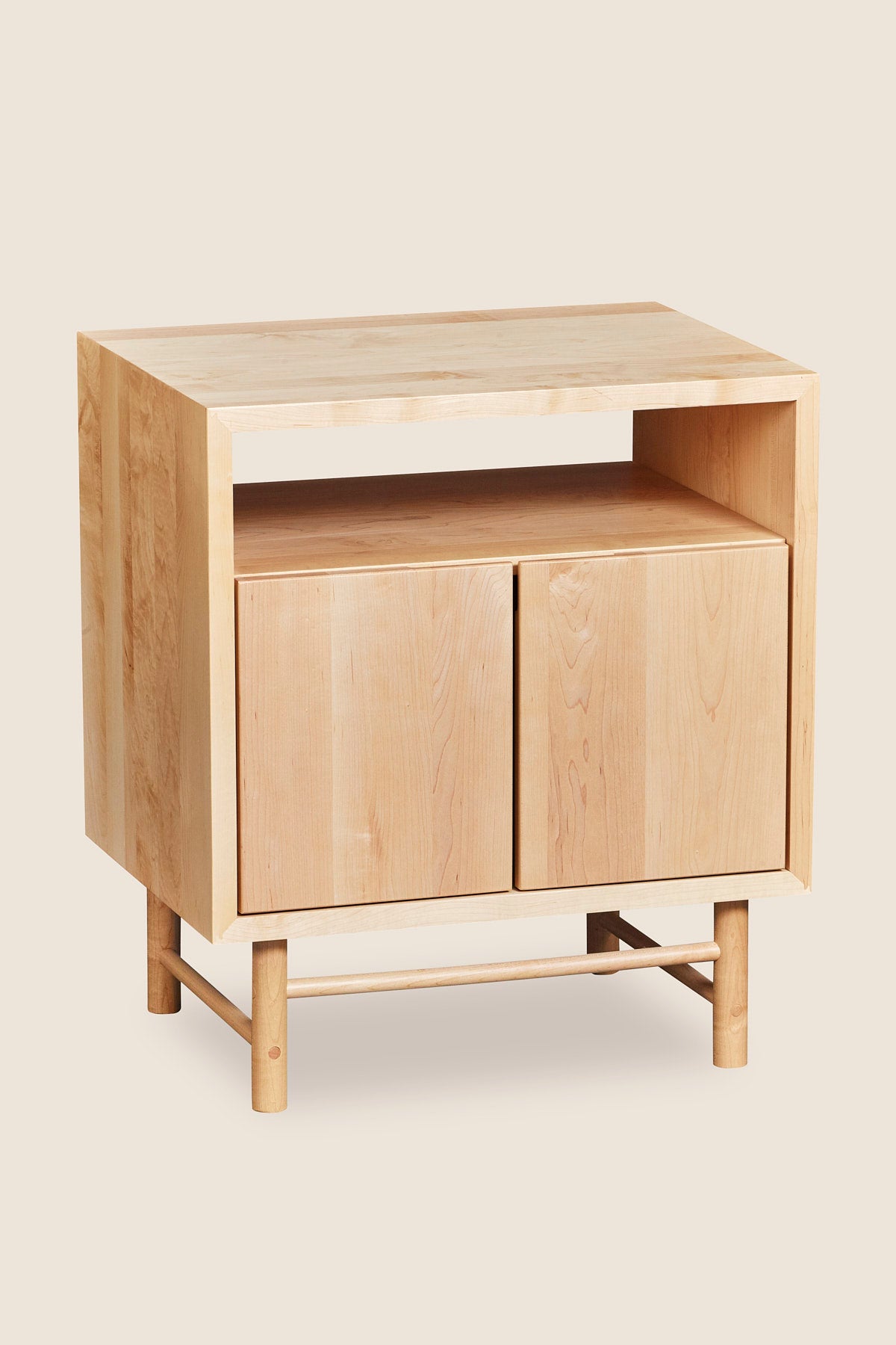 Mid-century modern Navarend media case in solid maple wood with round legs and stretchers and two doors with storage space