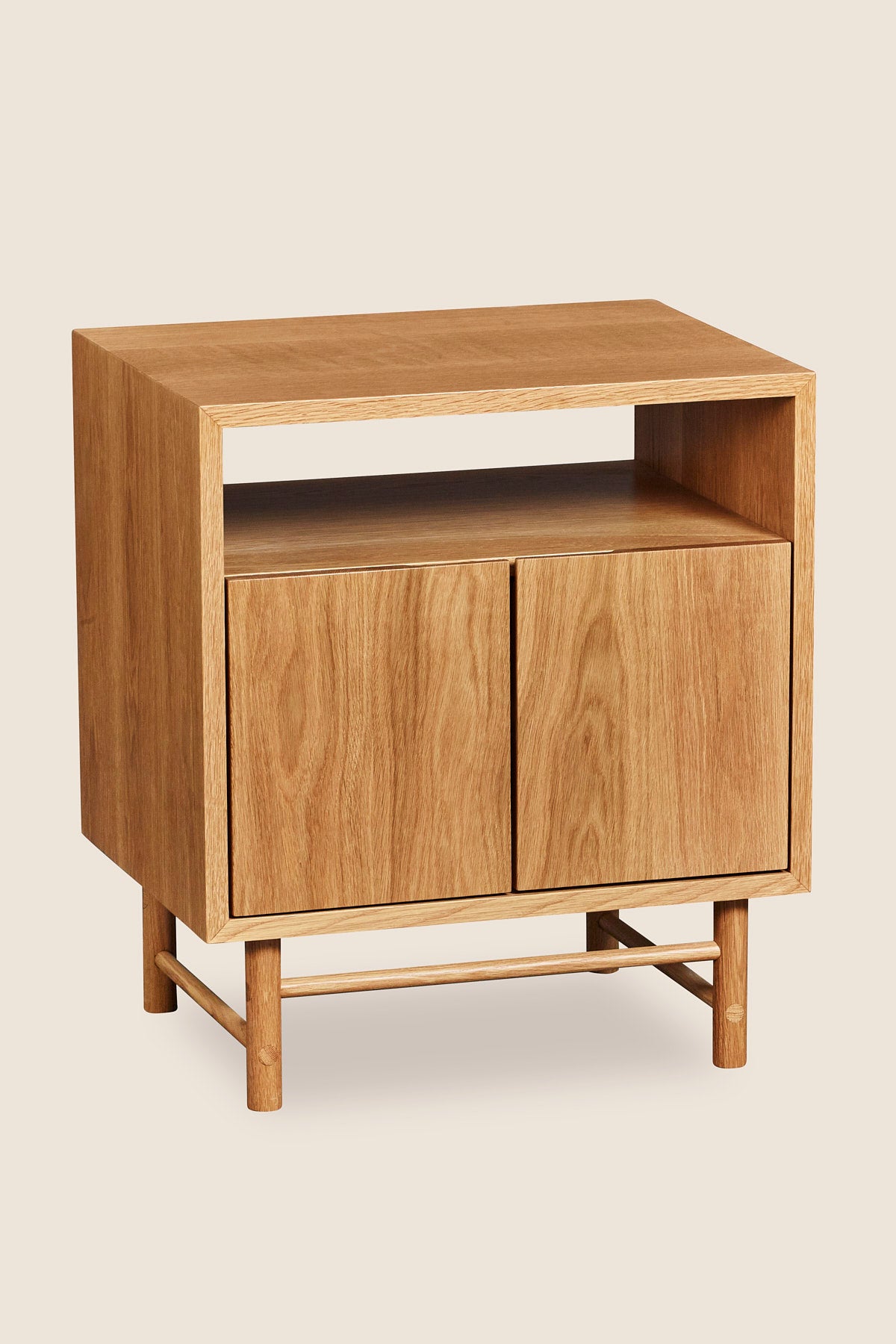 Mid-century modern Navarend media case in solid white oak wood with round legs and stretchers and two doors with storage space