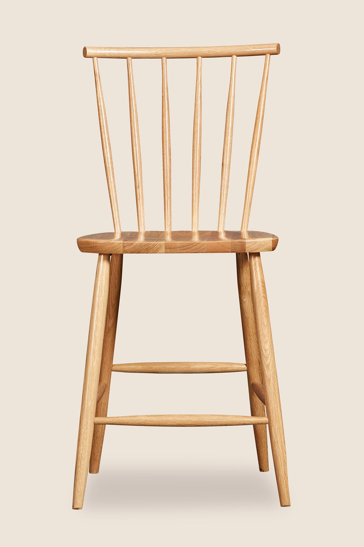 Windsor style stool with round crest in oak