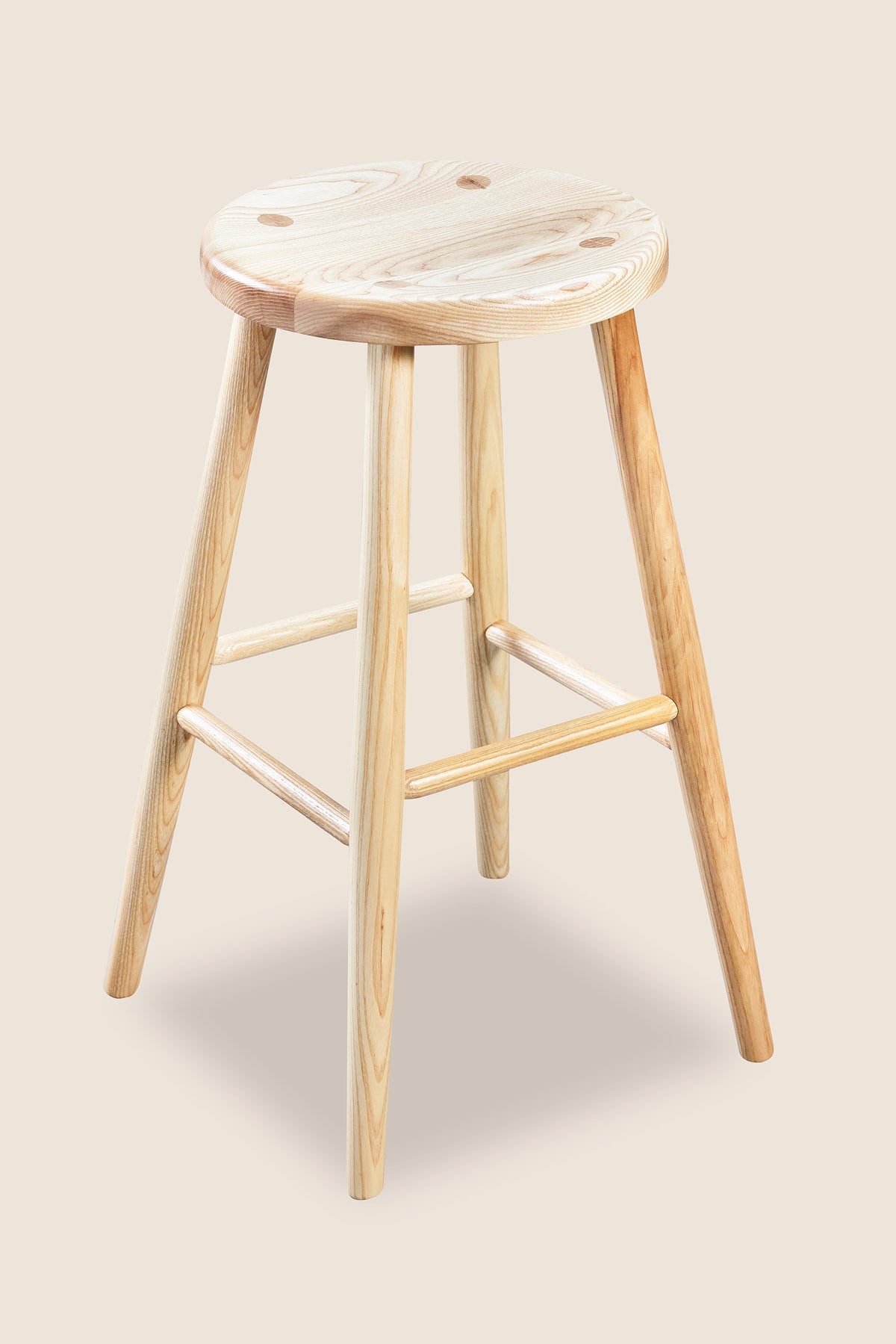 Simple round solid ash wood stool, from Maine's Chilton Furniture Co.