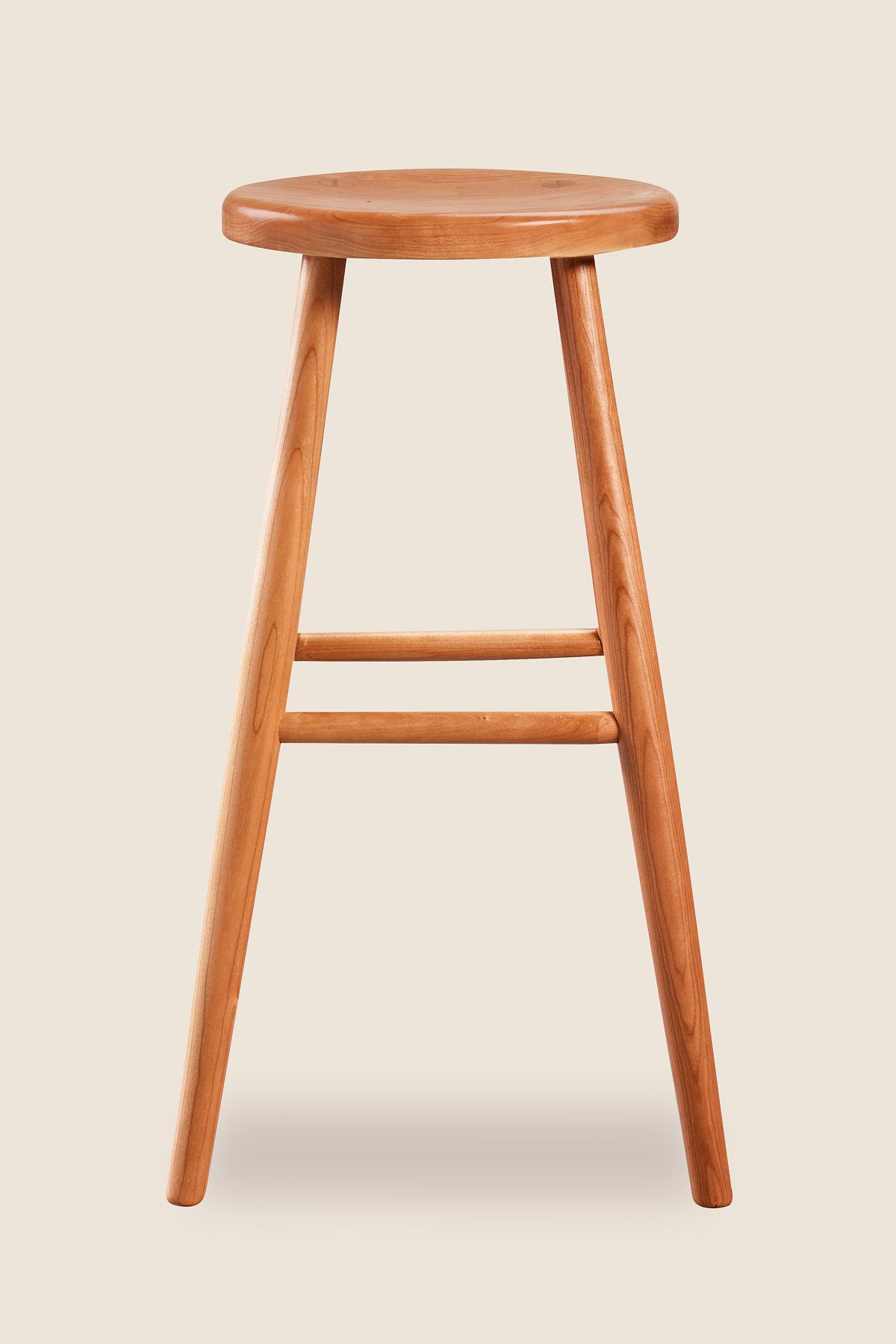 Simple round solid cherry wood stool, from Maine's Chilton Furniture Co.
