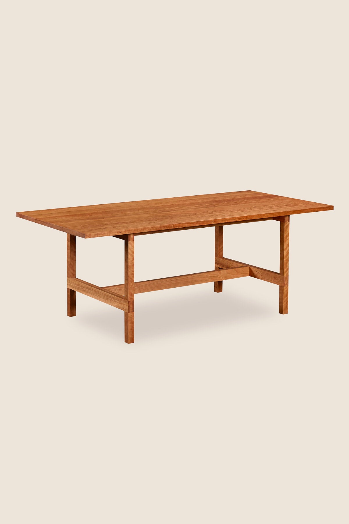 Modern trestle table with visible joinery in cherry, from Maine's Chilton Furniture Co.