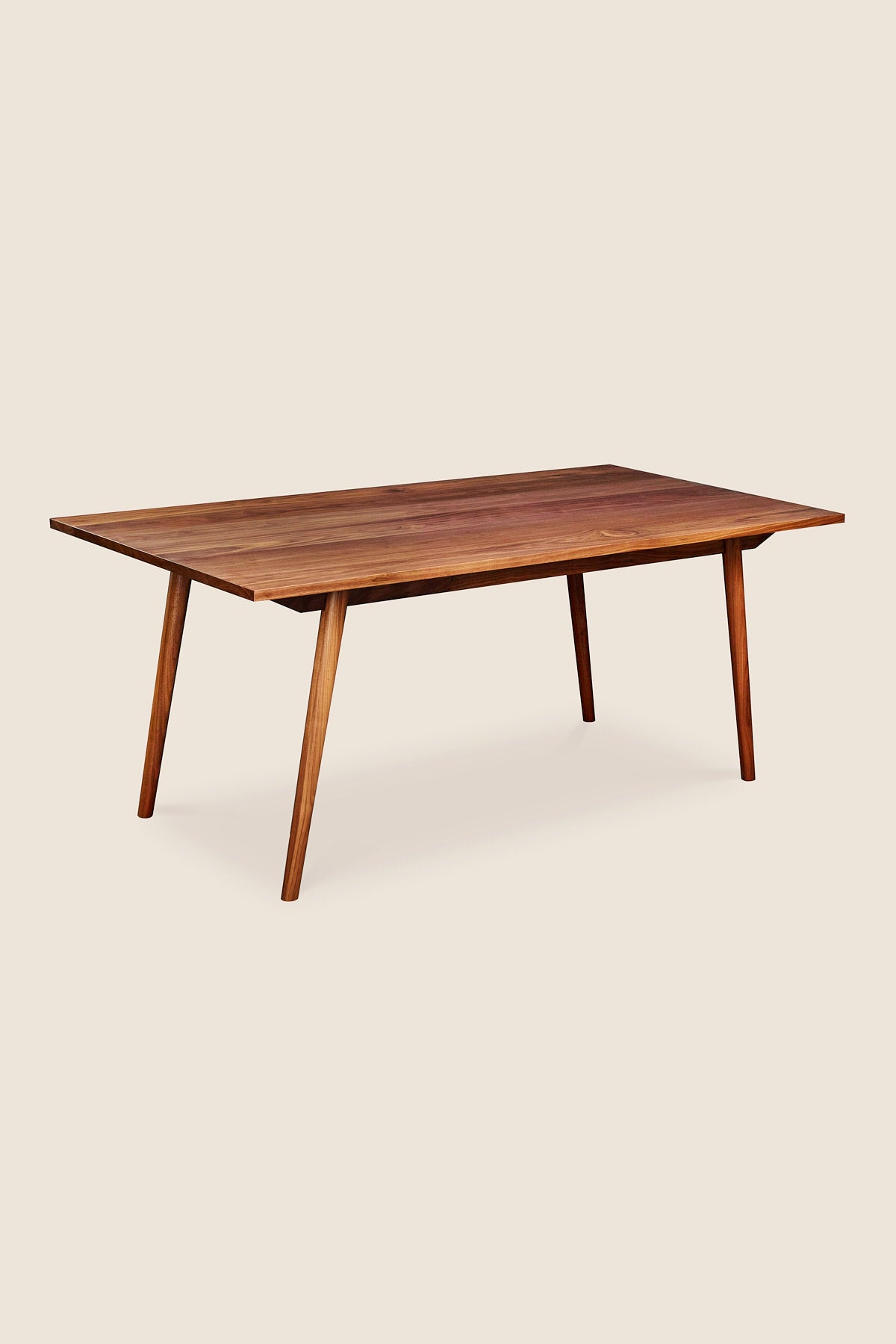 Mid-century Scandinavian rectangle dining table with angled legs in solid walnut wood