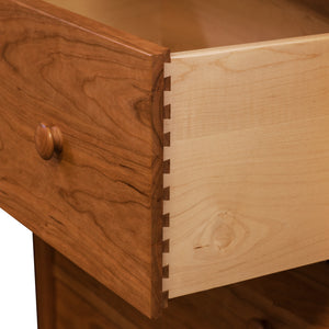 Open drawer of solid cherry Bethel Shaker Nightstand showing dovetail joinery