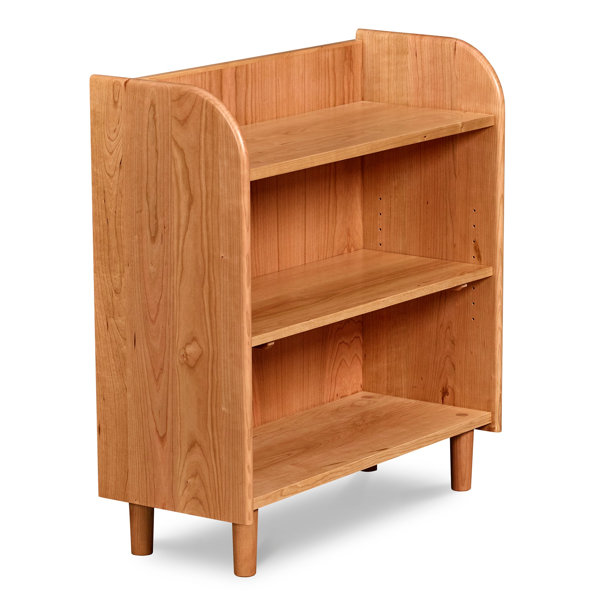 Bookshelf with open top, rounded corners, and round tapered legs, in cherry wood.