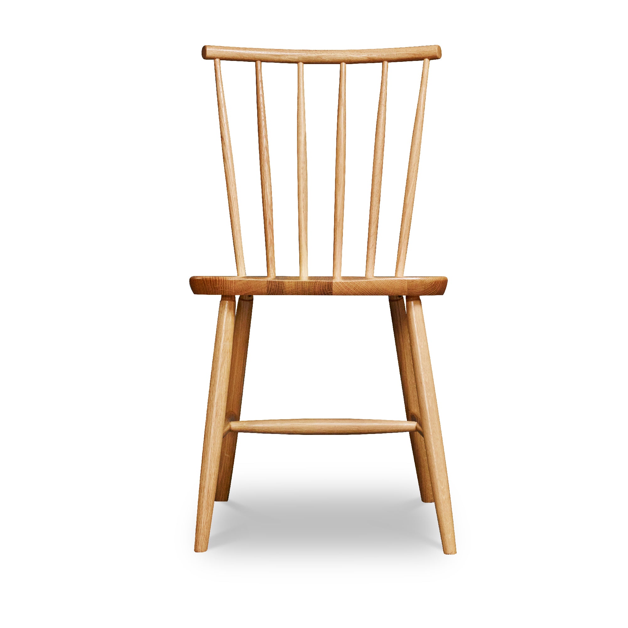 Windsor style chair with round crest in oak