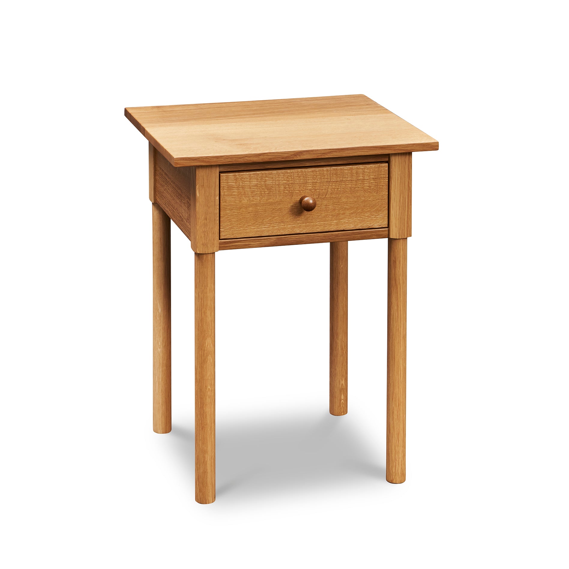 Modern interpretation of a classic Shaker style nightstand with one drawer and rounded legs, in solid white oak wood