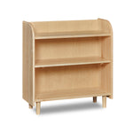Bookshelf with open top, rounded corners, and round tapered legs, in maple wood.
