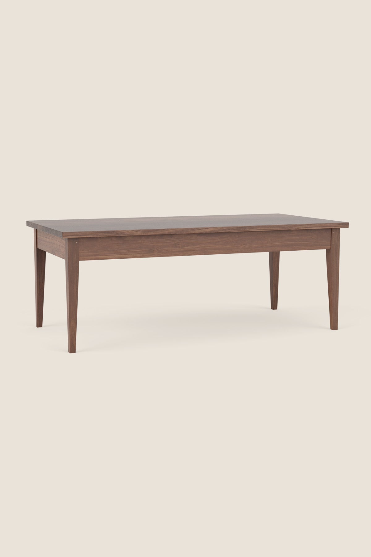 Simple Shaker style coffee table in walnut on beige background