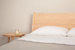 Minimalist bedroom with Mysa Nightstand and Bed in solid maple wood