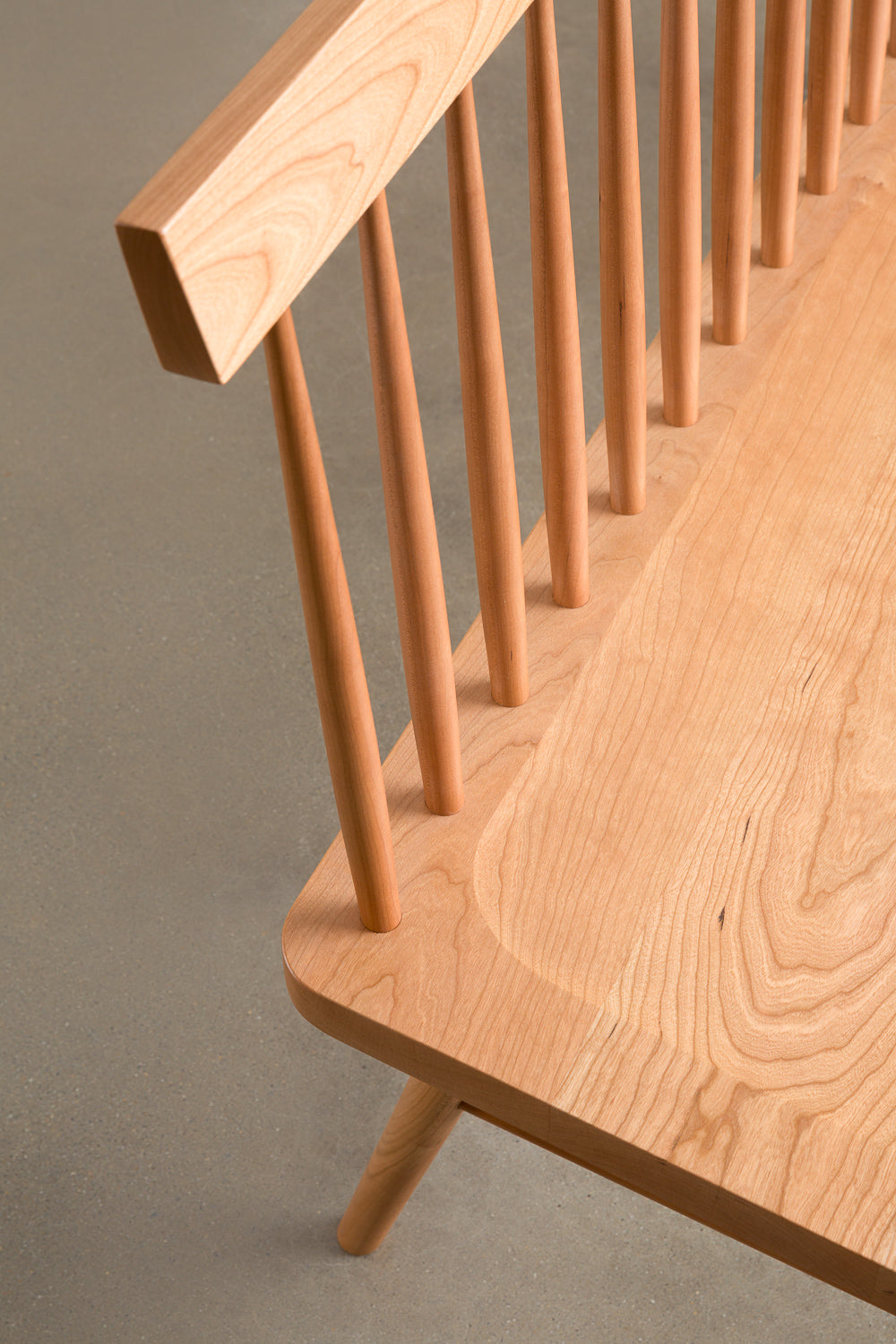Close up details of the angles and curves on the spindle back Broadside Bench