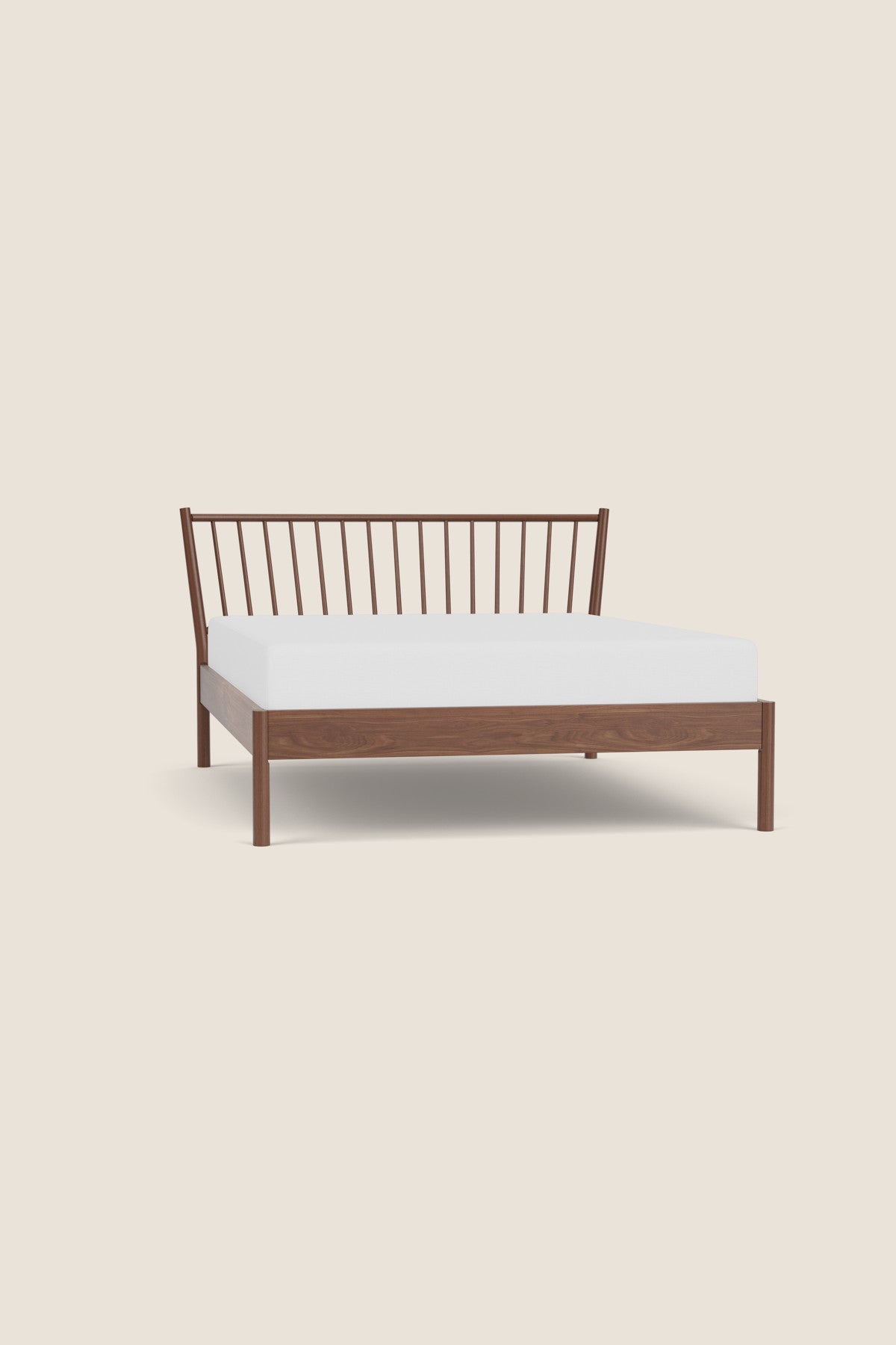 Walnut Chamberlain Bed frame on beige background
